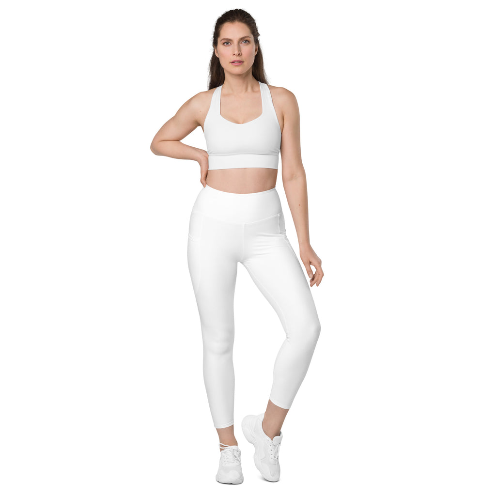 Women’s white seamless high-waisted yoga leggings with subtle side pockets and soft compression fabric