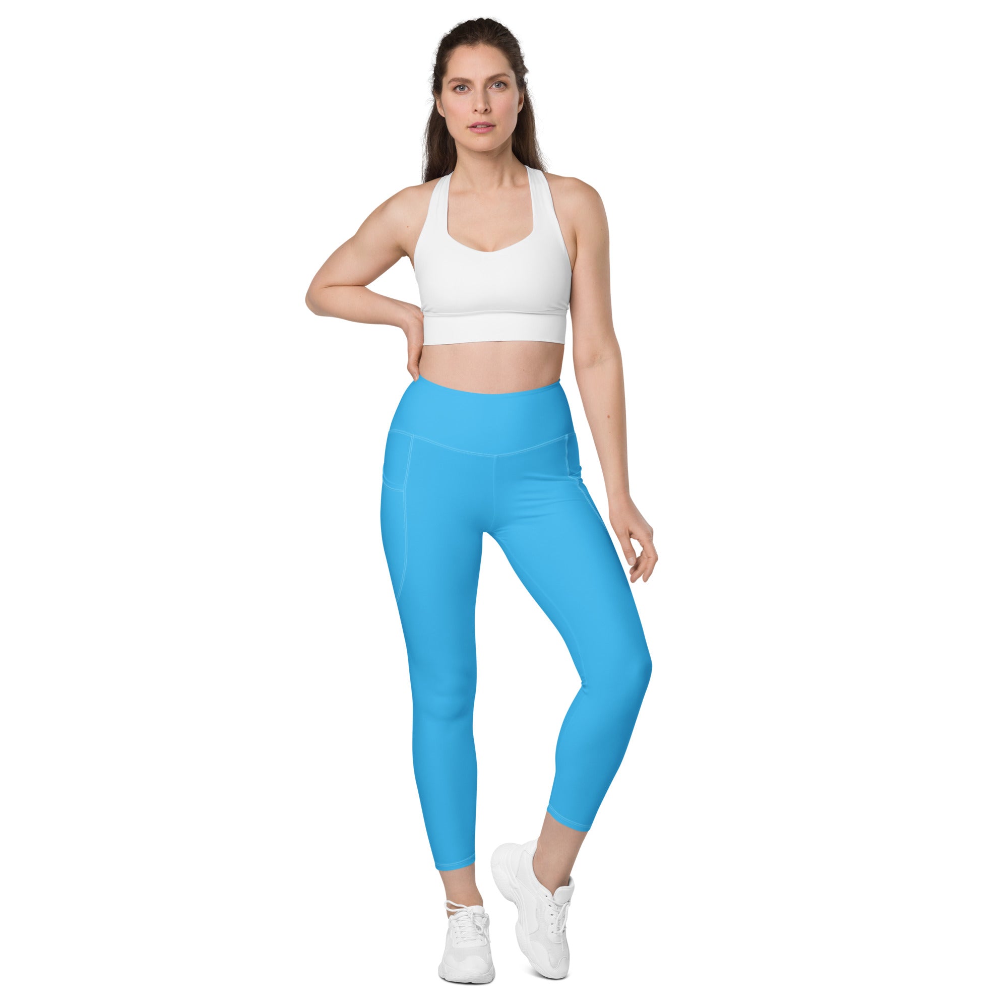 Bright blue women’s high-waisted yoga leggings with pockets soft compression fabric and a sleek form-fitting design