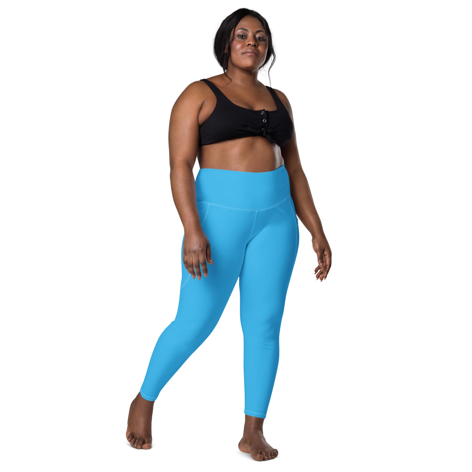 Bright blue high-waisted women’s yoga leggings with pockets made of stretchy soft compression fabric