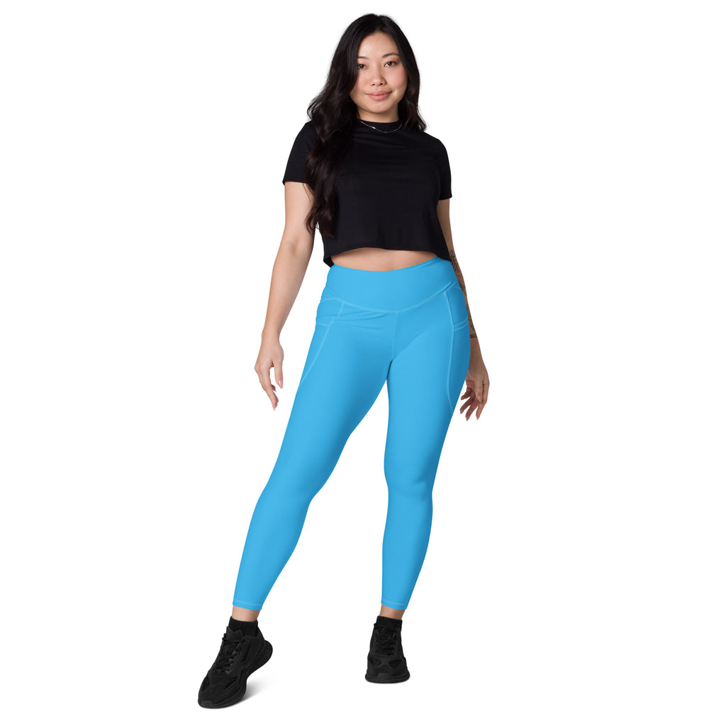 Women’s bright blue high-waisted yoga leggings with pockets featuring soft compression and a sleek form-fitting design