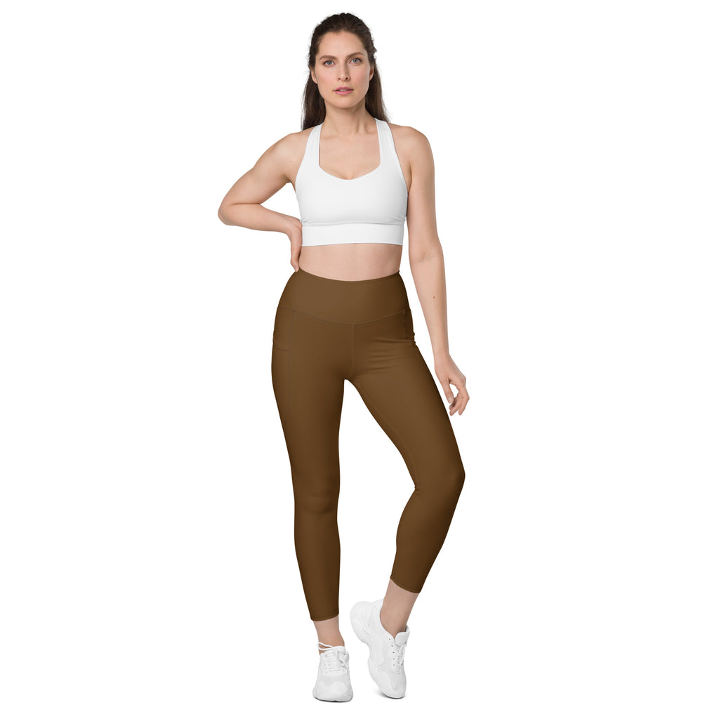 Women’s brown high-waisted yoga leggings with pockets made of soft compression fabric, sleek and form-fitting design