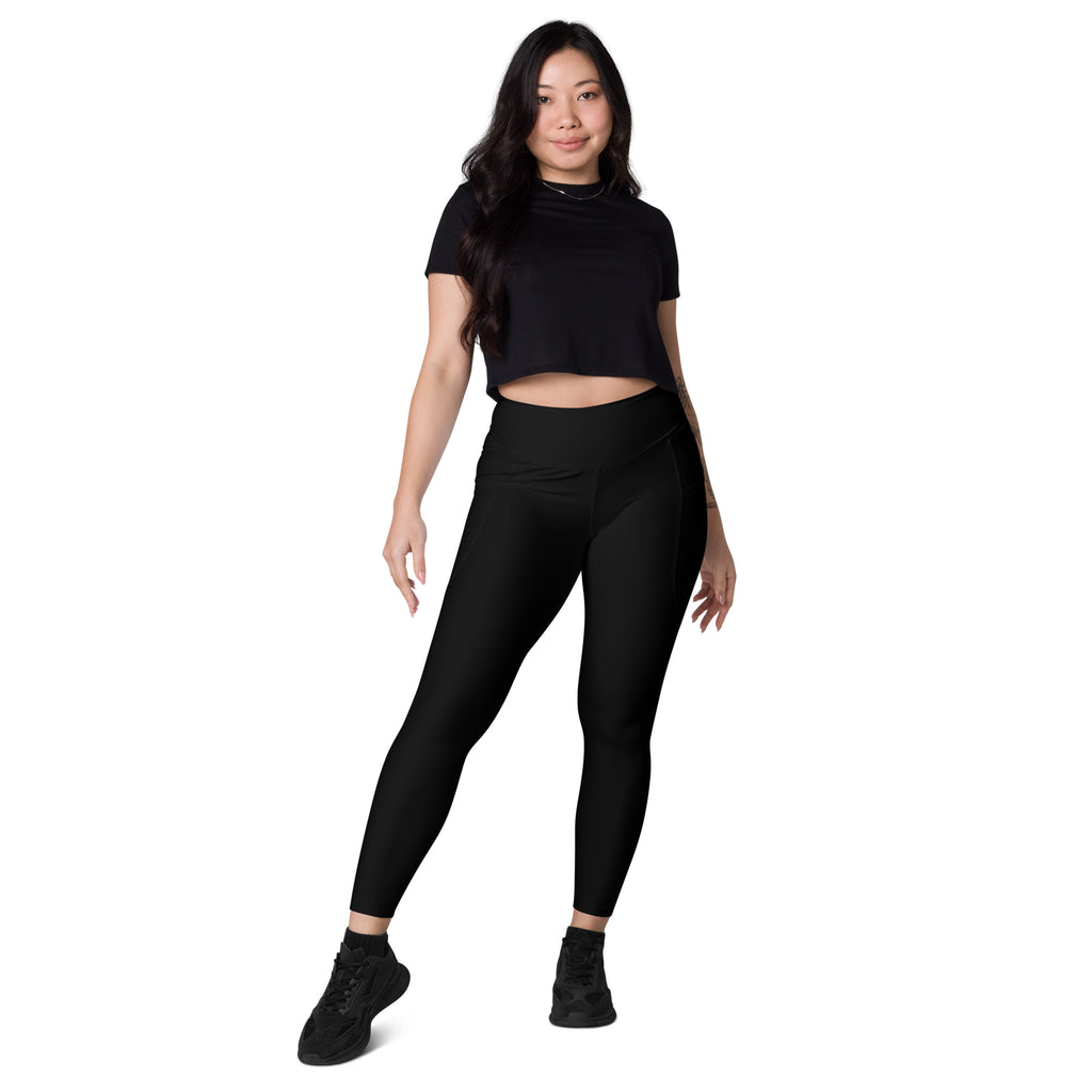 Women’s black high-waisted yoga leggings with pockets made from soft compression fabric featuring subtle side seam detailing