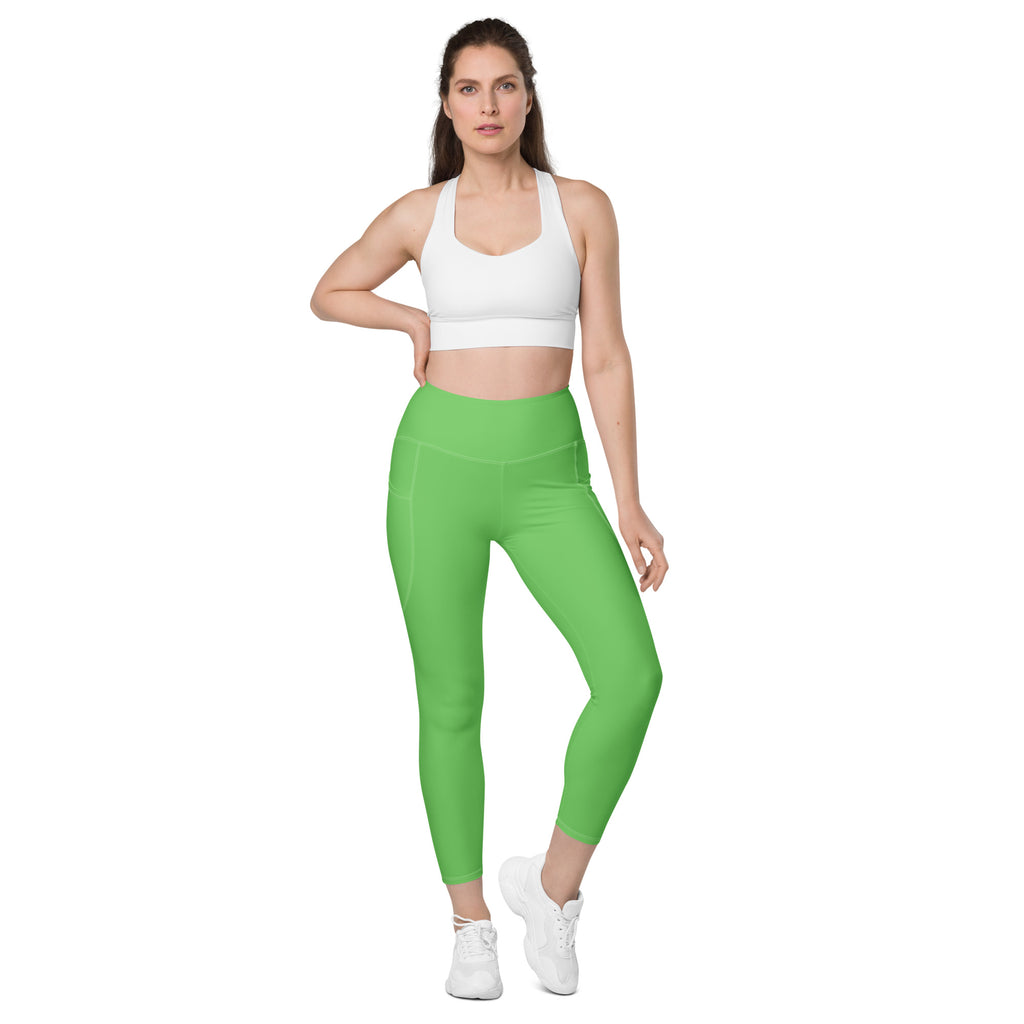 Bright green high-waisted women’s yoga leggings with pockets soft compression and sleek form-fitting design
