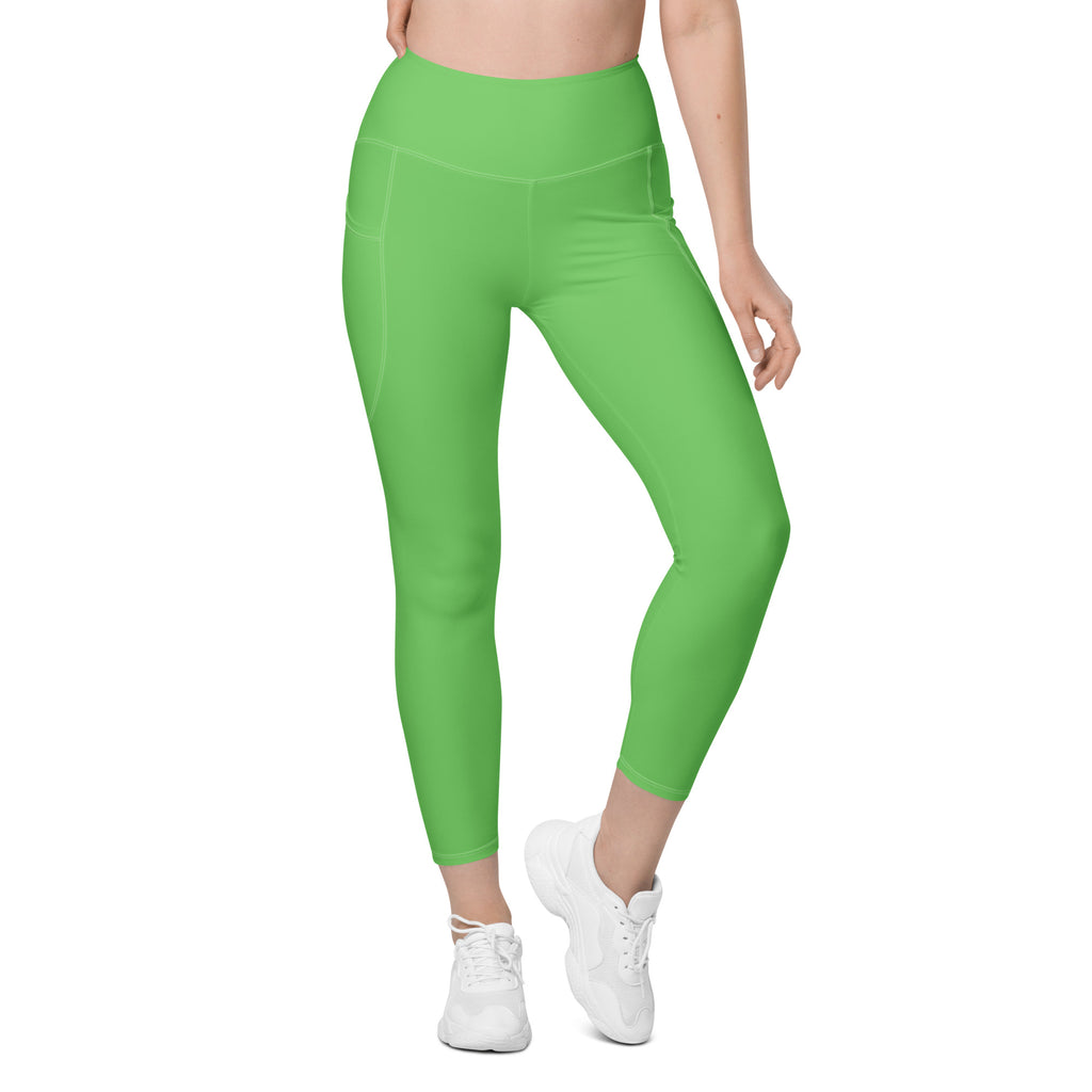 Women’s bright green high-waisted yoga leggings with soft stretchy fabric and side pockets for activewear use