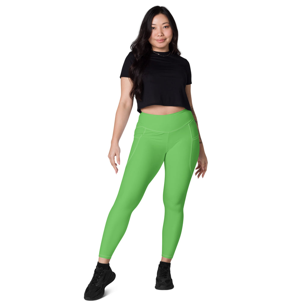 Bright green women’s high-waisted yoga leggings with pockets and soft compression for active wear