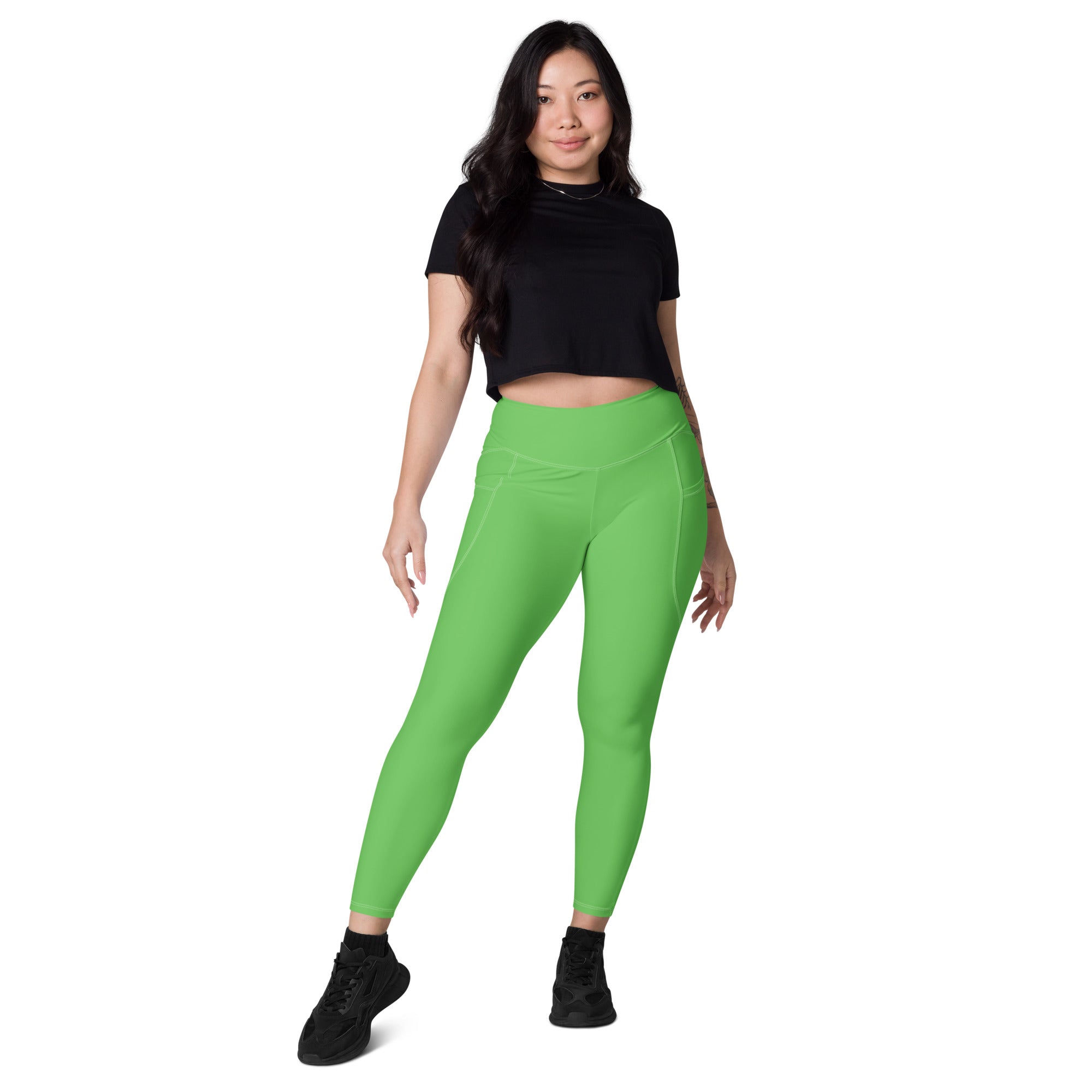 Bright green women’s high-waisted yoga leggings with pockets and soft compression for active wear