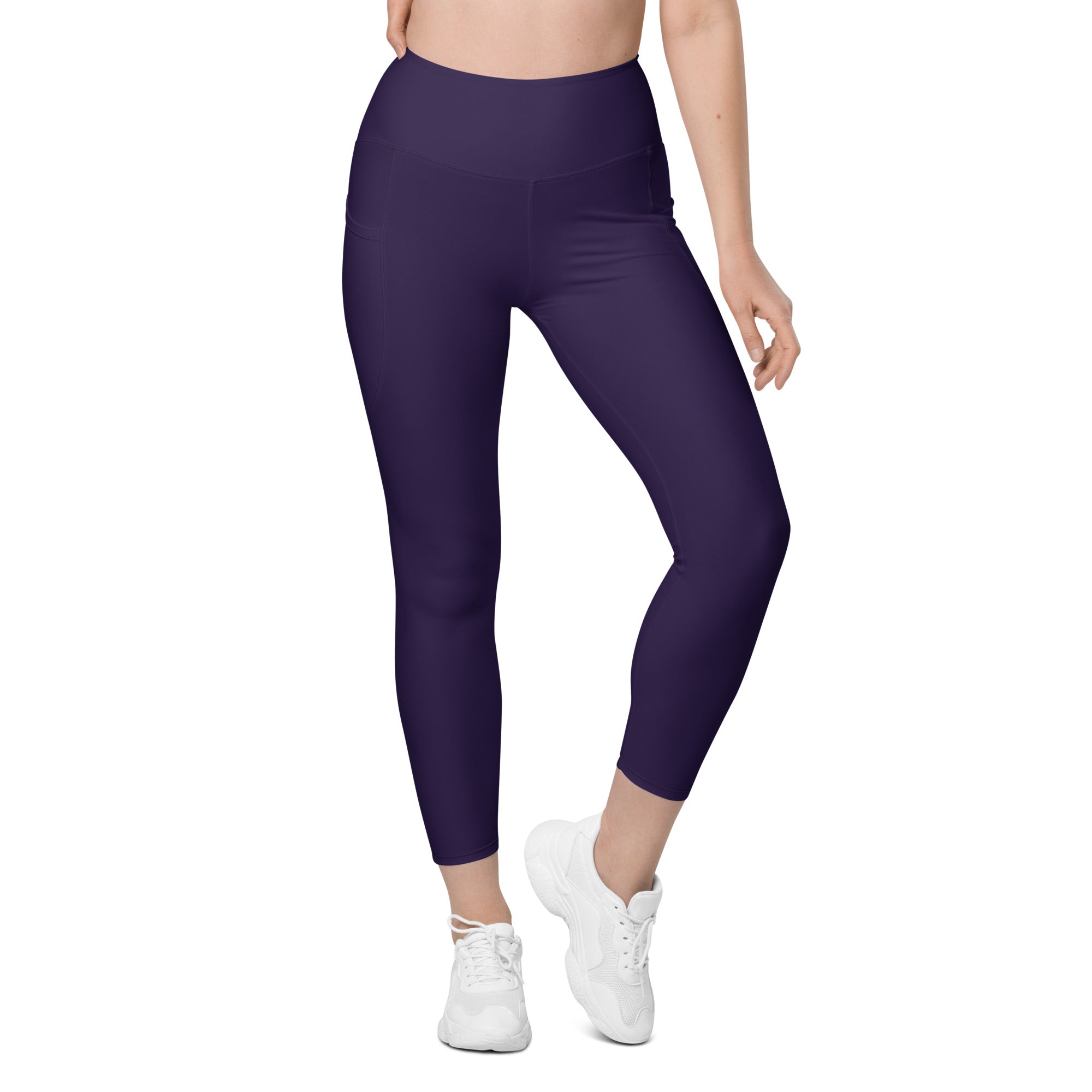 Women’s dark purple high-waisted yoga leggings with pockets made of soft stretchy compression fabric