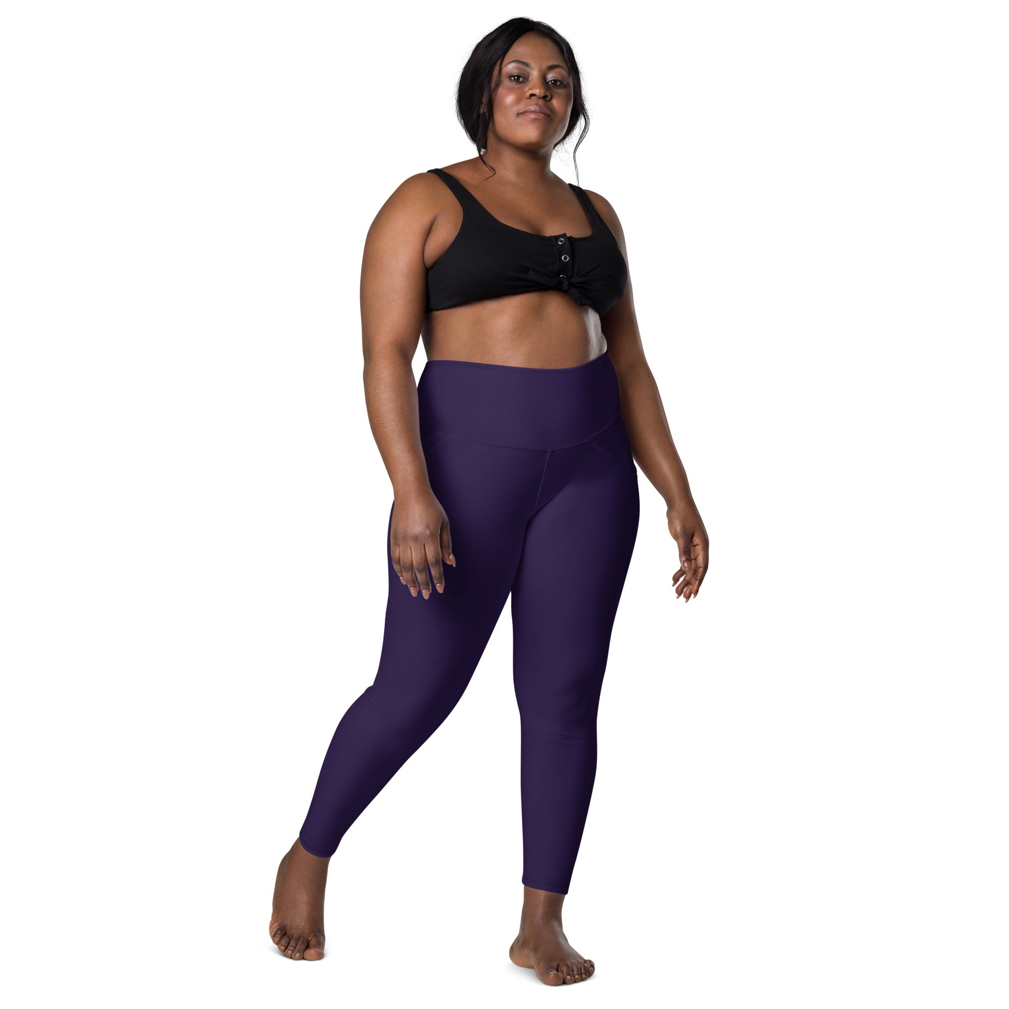 Women’s dark purple high-waisted yoga leggings with pockets made of soft compression fabric for active wear
