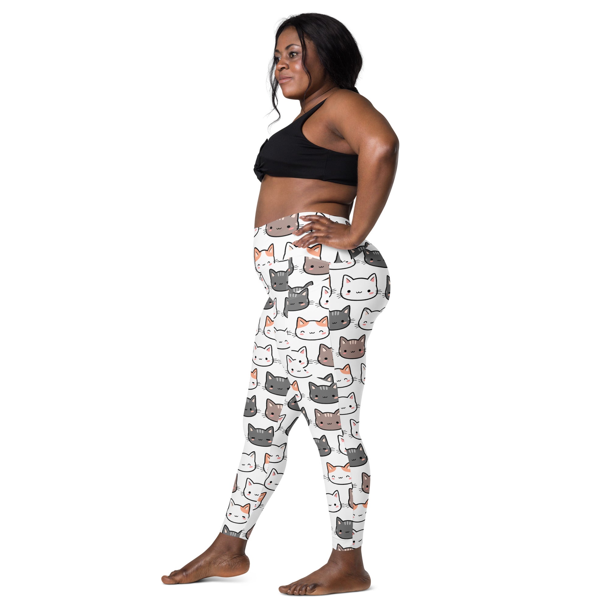 White womens high-waisted yoga leggings with soft compression and playful multicolor cartoon cat pattern with pockets