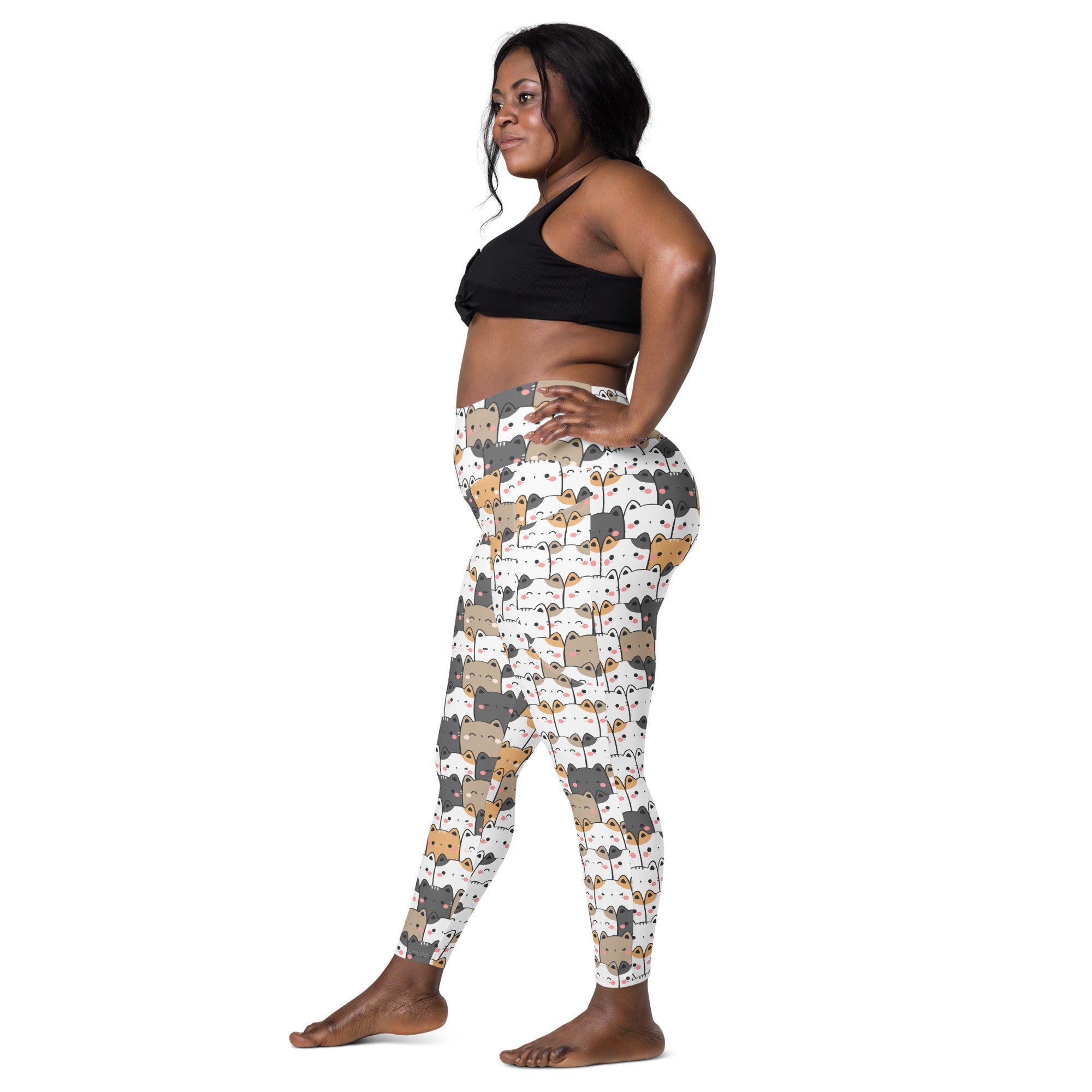 White high-waisted kawaii cat yoga leggings with pockets featuring playful gray beige and black cartoon cats pattern