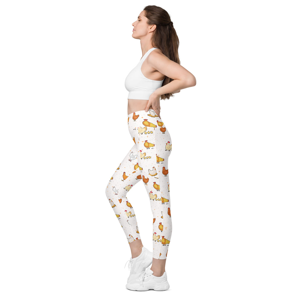 White women’s chicken yoga leggings with pockets high-waisted soft compression featuring playful orange yellow brown cartoon chickens