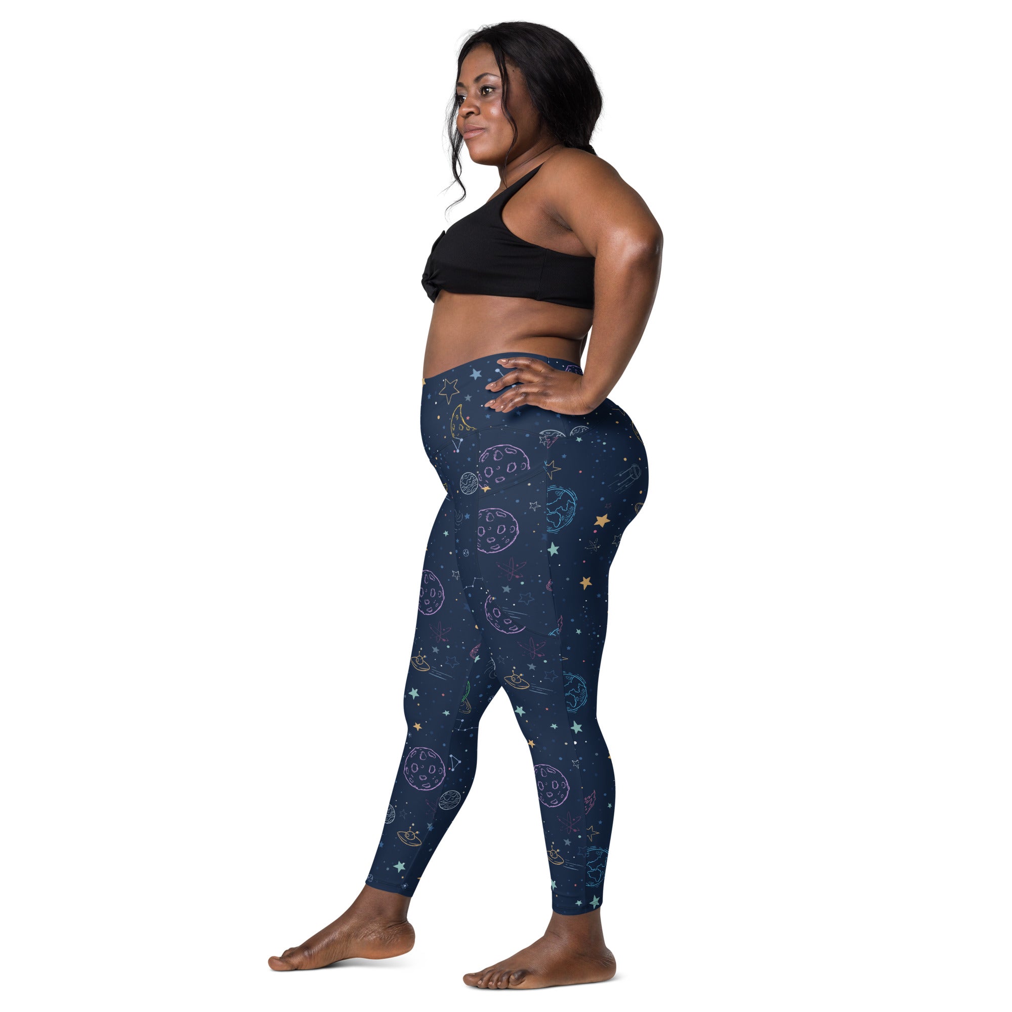 Navy blue high-waisted women’s yoga leggings with soft compression and pastel celestial moons stars and planets pattern