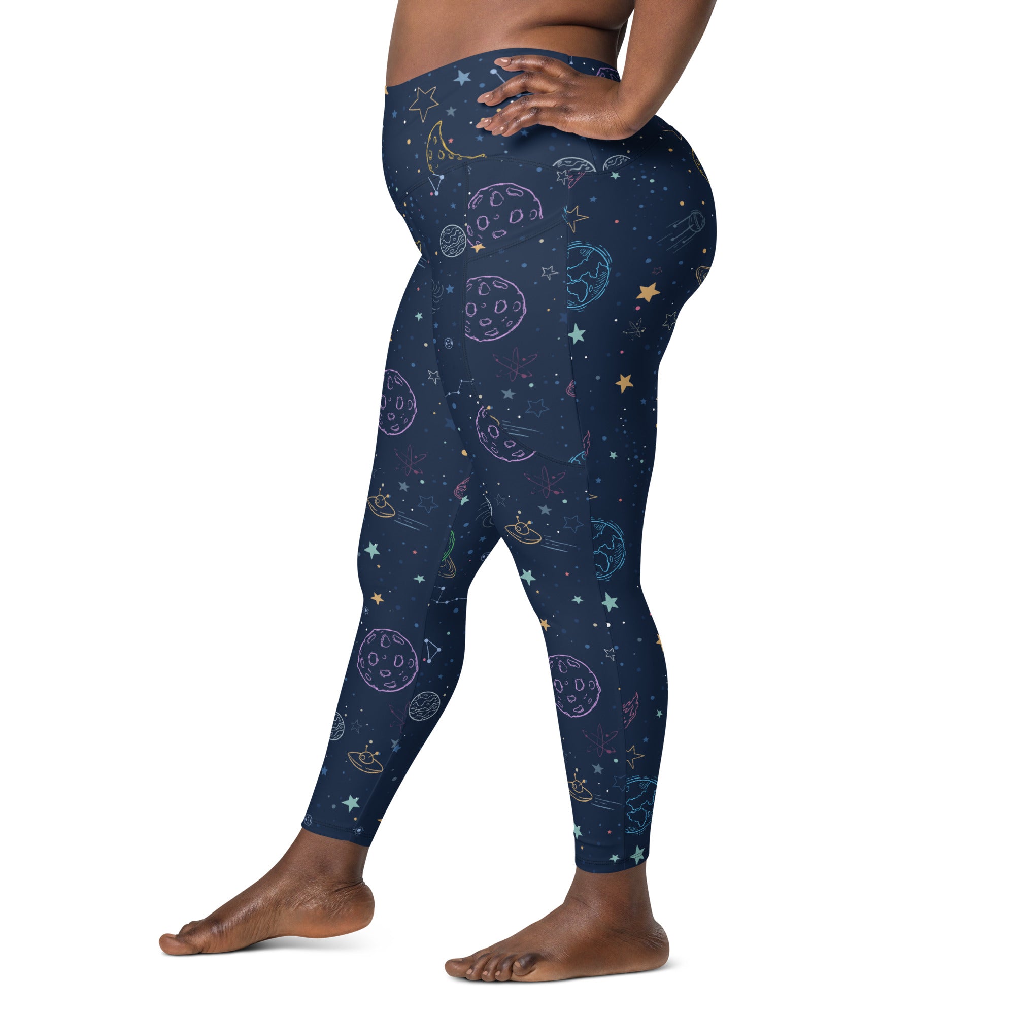 Dark blue plus-size high-waisted yoga leggings with pastel moons stars and planets pattern and pockets