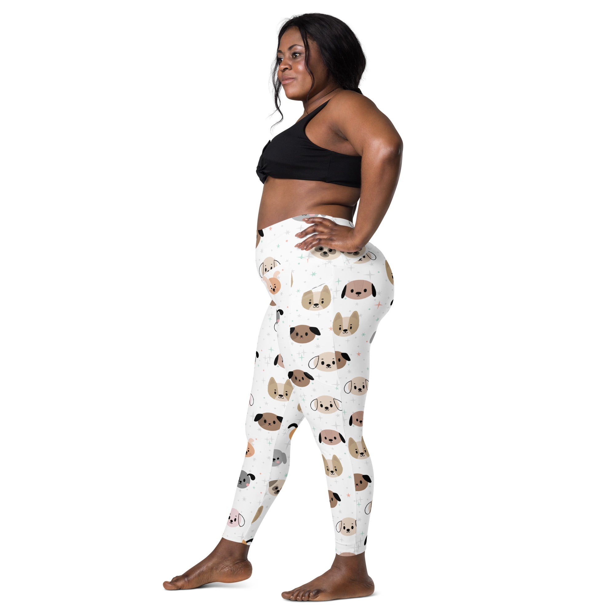 Women’s white dog face yoga leggings with pockets featuring playful brown tan and gray cartoon dogs in soft compression fabric