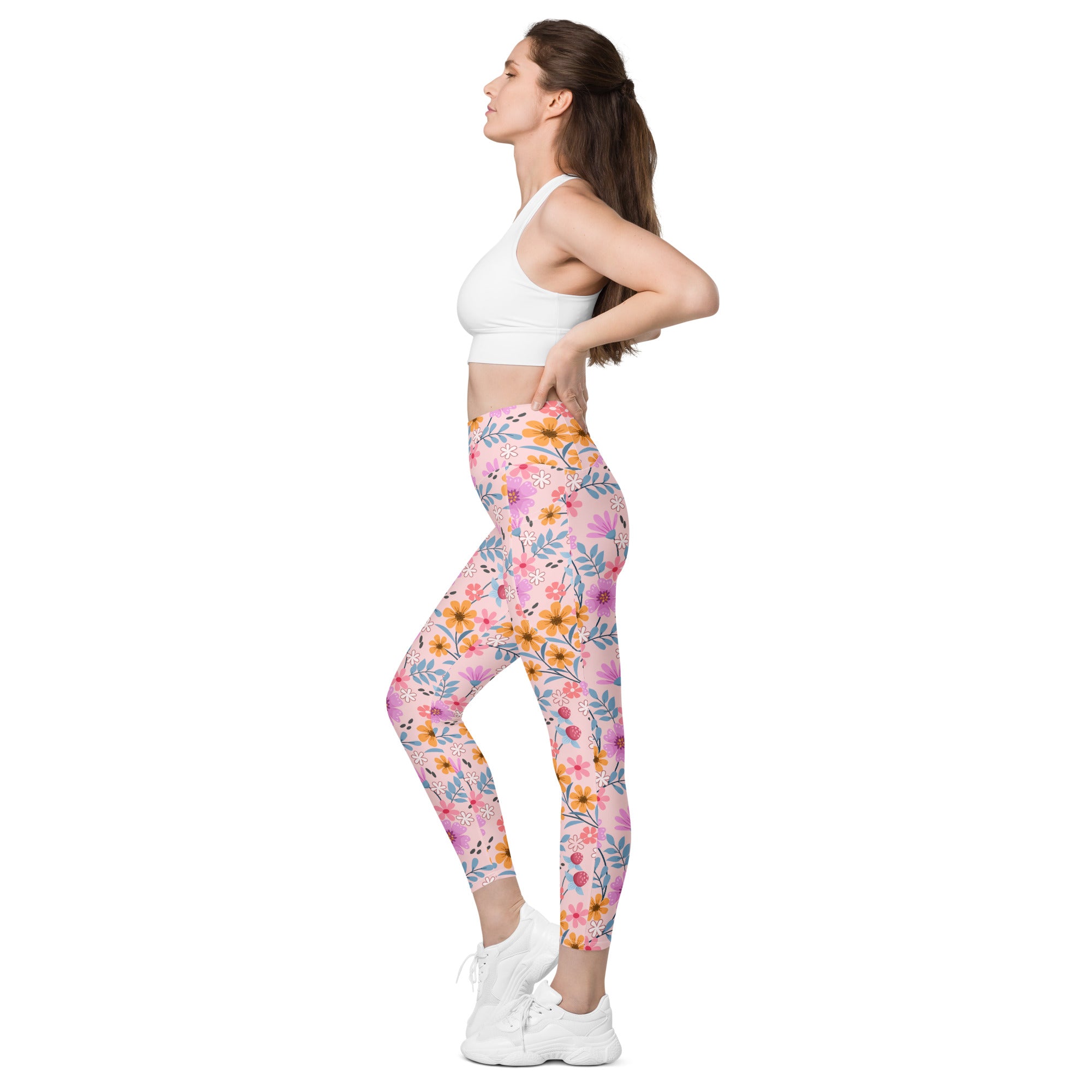 Women’s pink floral yoga leggings with orange and blue accents high-waisted soft compression and pockets
