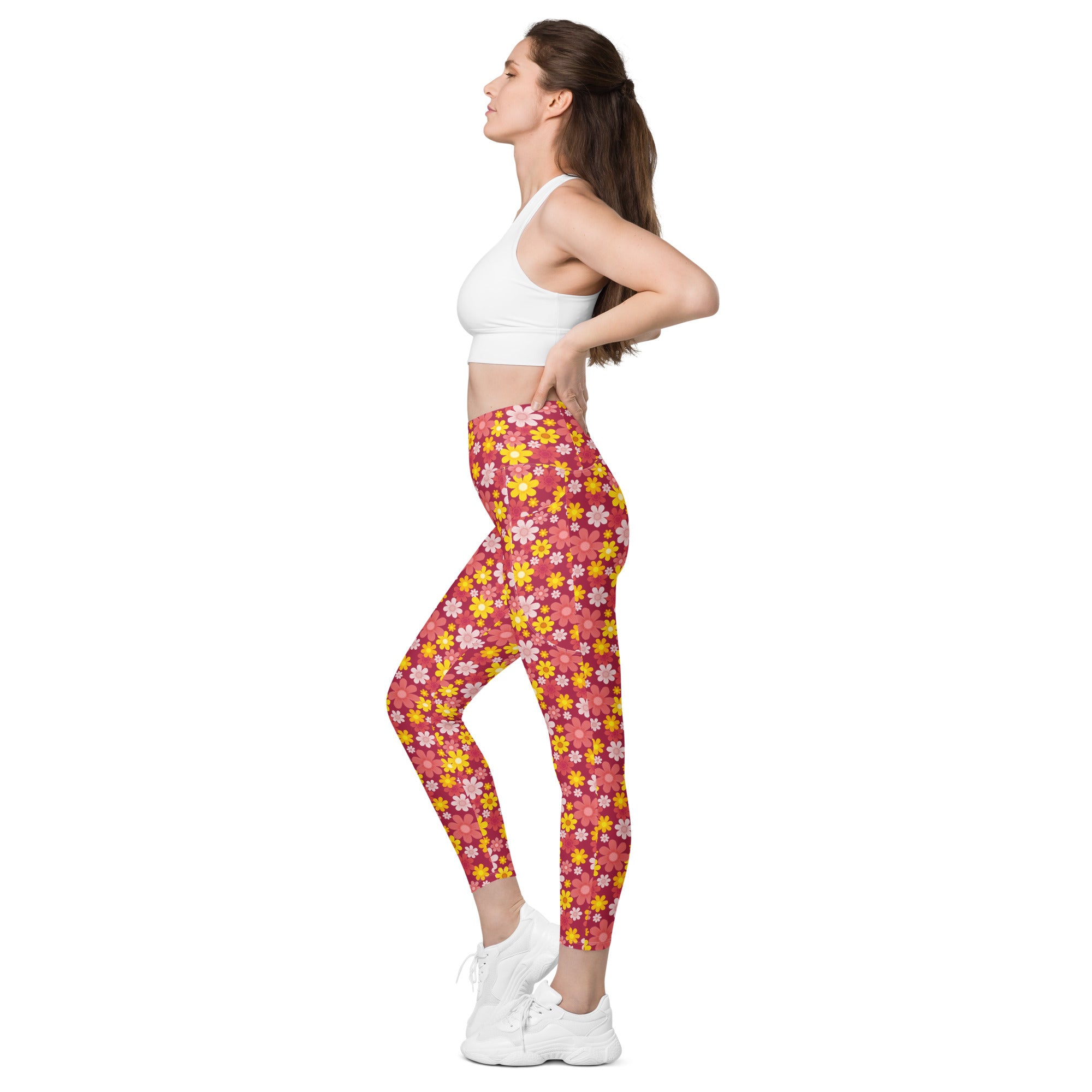 Women’s high-waisted red floral yoga leggings with pockets featuring soft compression in pink and yellow floral pattern