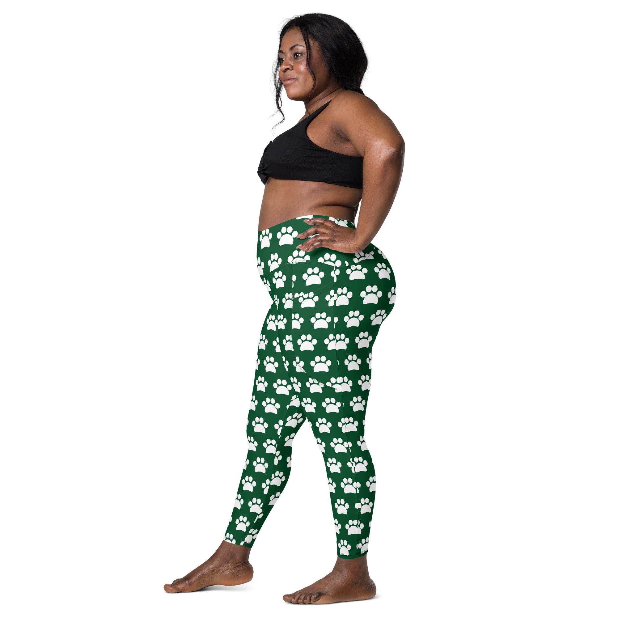 Women’s green high waisted yoga leggings with white paw print pattern soft compression and pockets