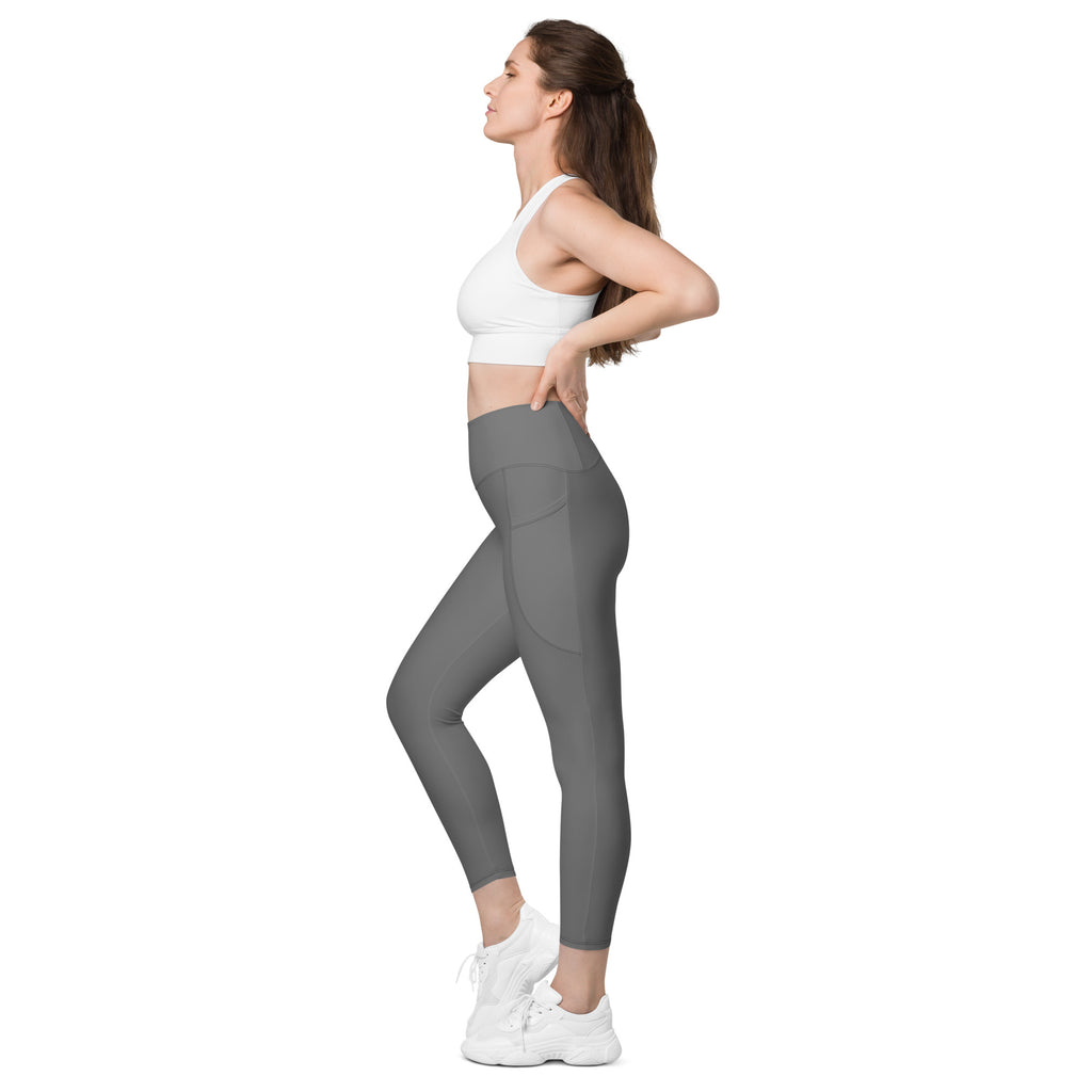 Women’s gray high-waisted yoga leggings with pockets featuring soft compression and subtle side panel detailing