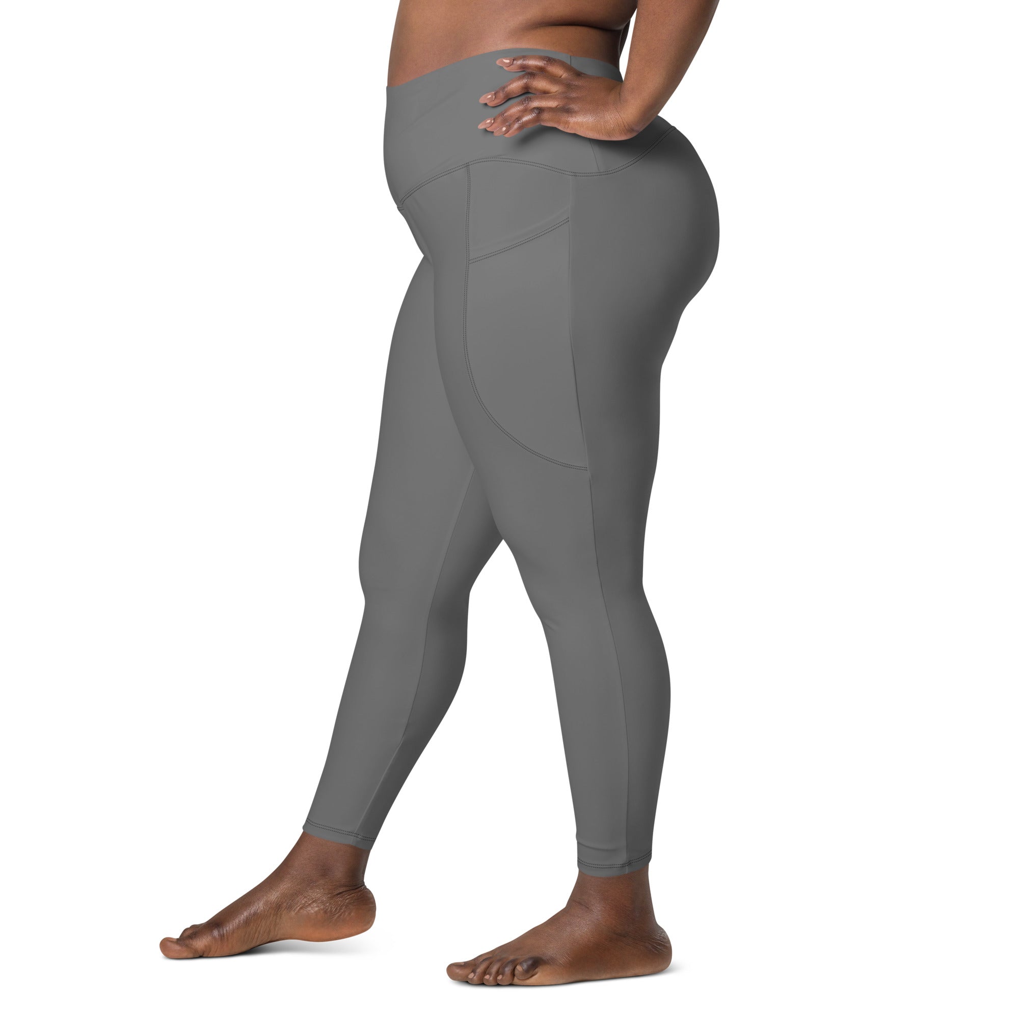 Women’s gray high-waisted yoga leggings with side pocket made from stretchy soft compression fabric