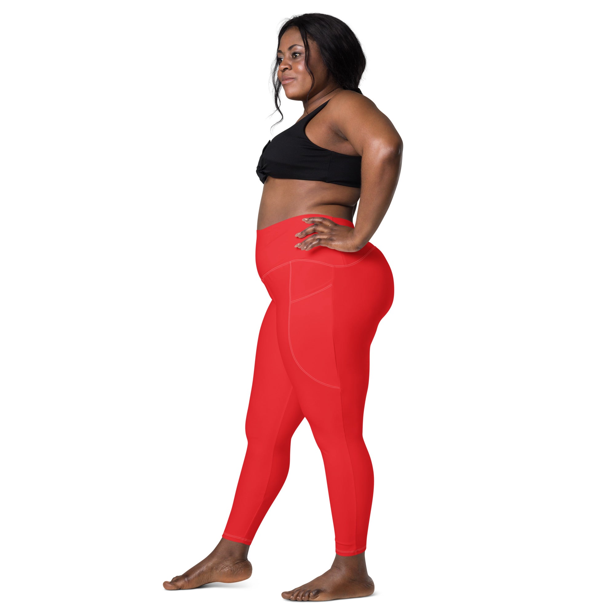Women’s bright red high-waisted yoga leggings with pockets made of smooth form-fitting stretch fabric