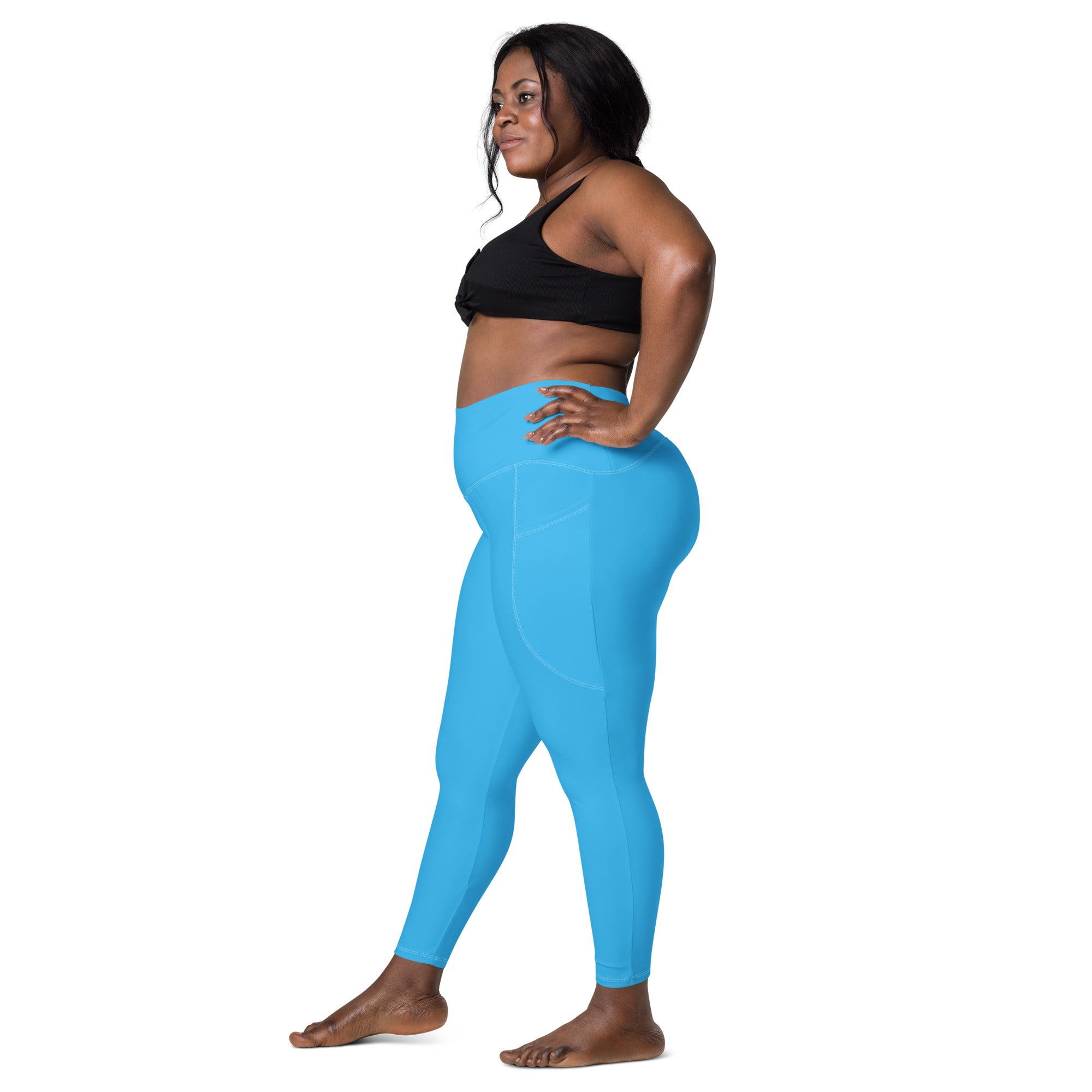 Women’s blue high-waisted yoga leggings with soft compression smooth material and subtle side pockets