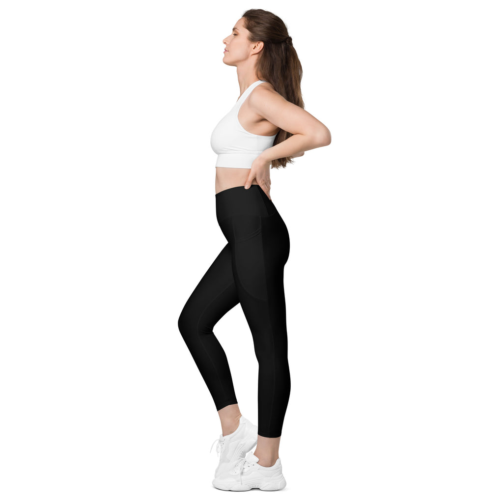 Women’s black high-waisted yoga leggings with pockets made of smooth, soft compression material for activewear