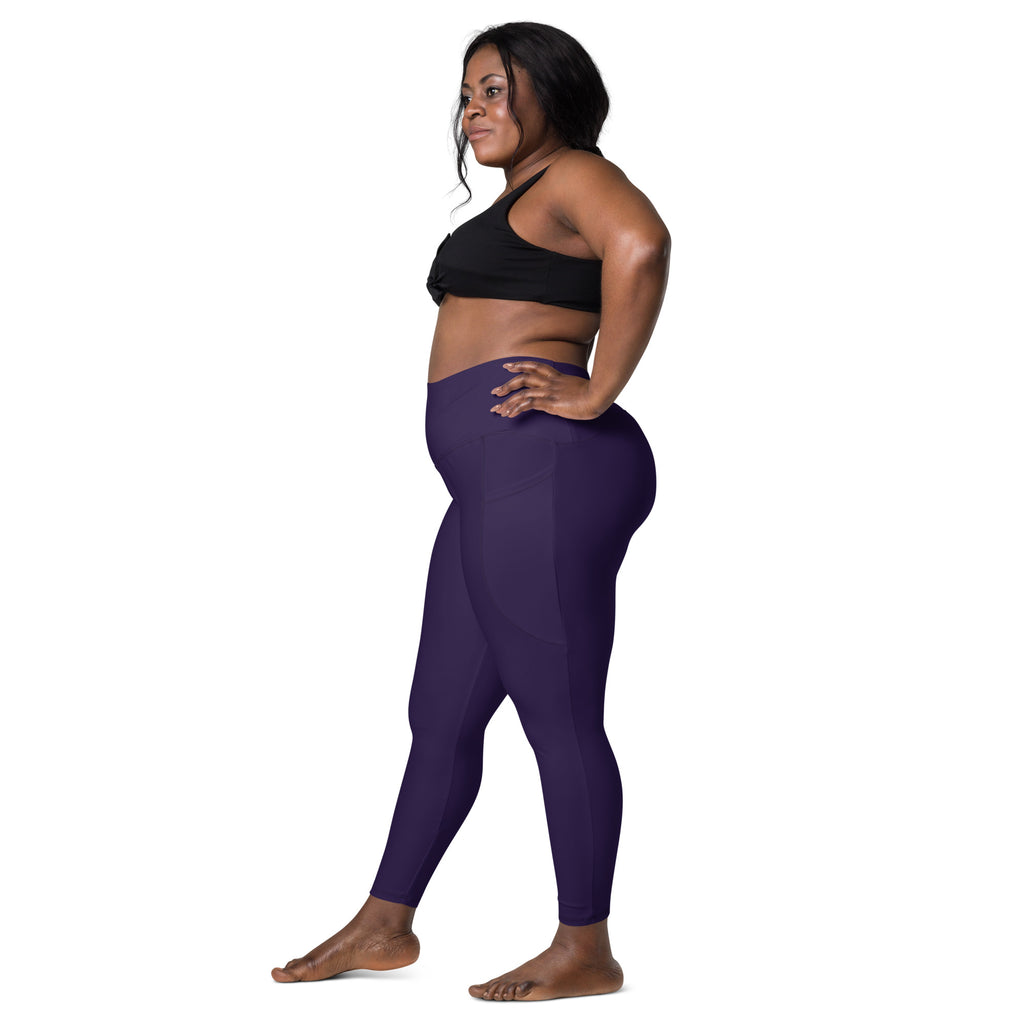 Women’s dark purple high-waisted yoga leggings with pockets made from soft compression fabric for active use