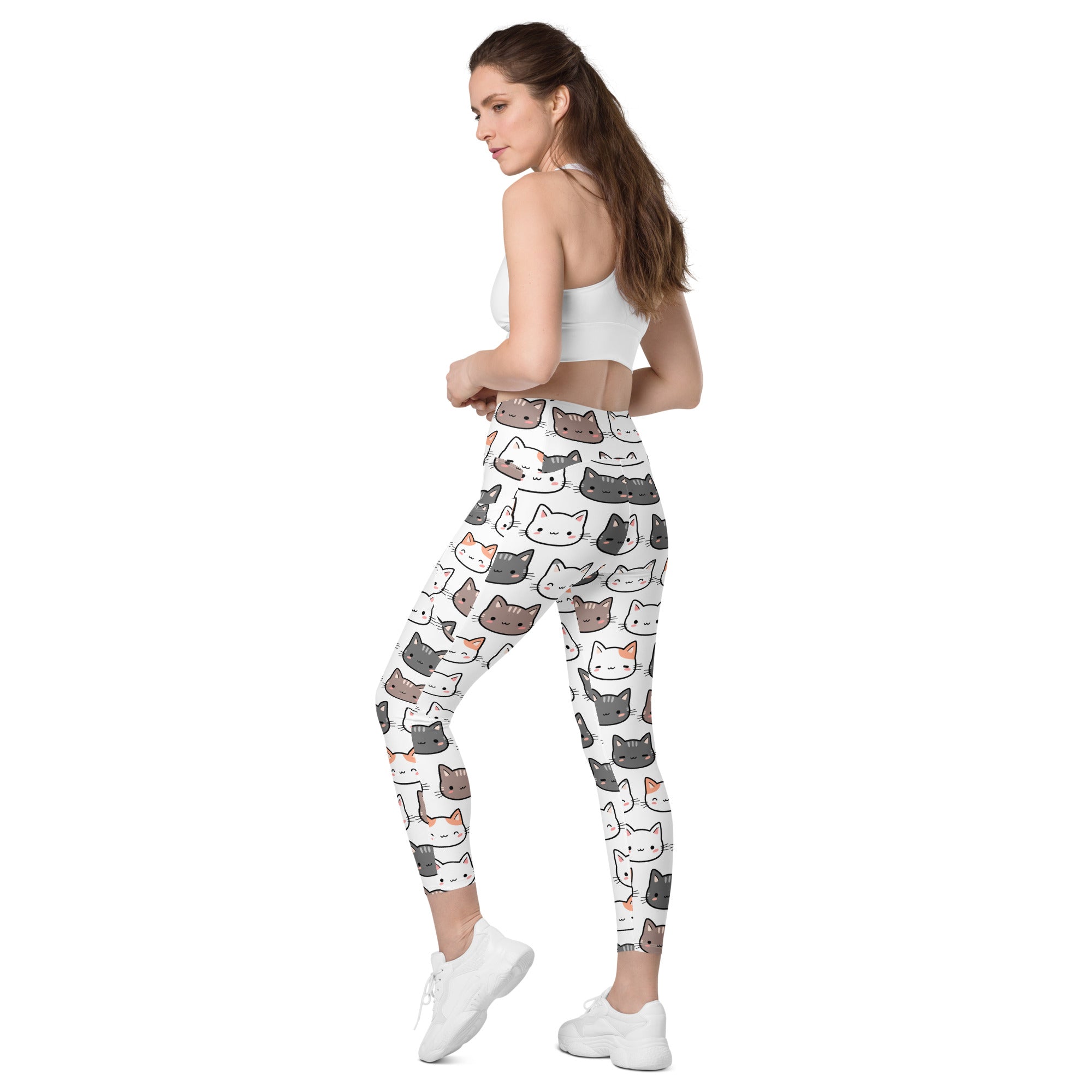 Women’s white high-waisted yoga leggings with soft compression and colorful cartoon cat pattern with pockets