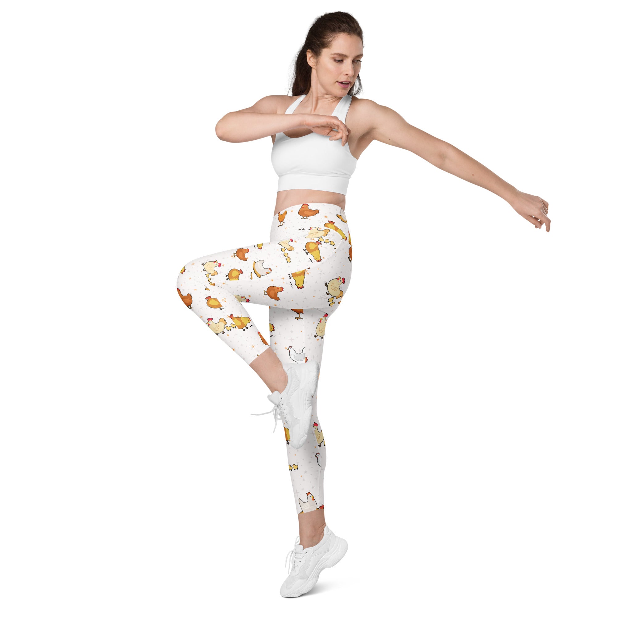 White leggings with colorful cartoon chickens featuring high-waisted soft compression and pockets for yoga and active wear