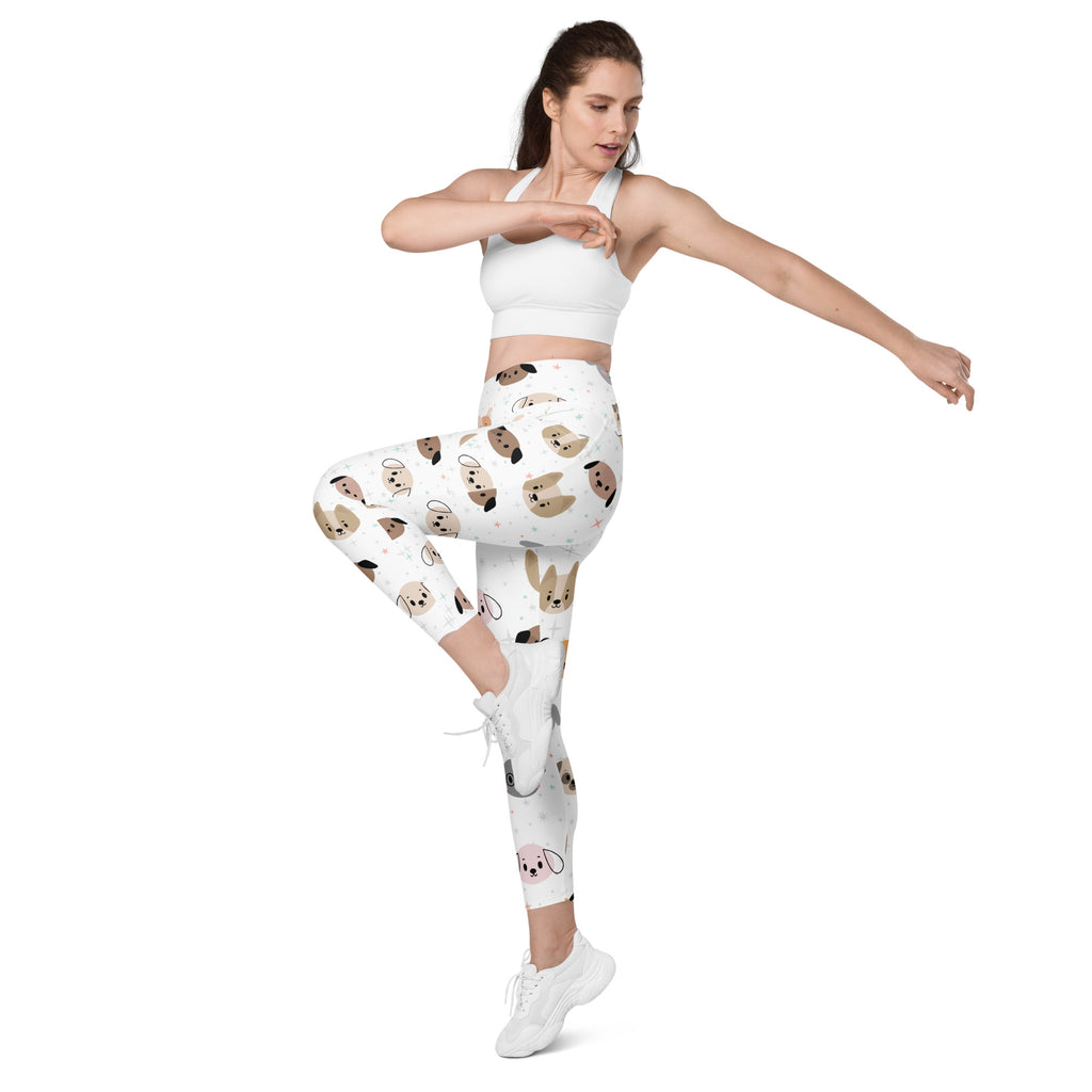 White high-waisted yoga leggings with pockets featuring a playful cartoon pug pattern and soft compression fabric