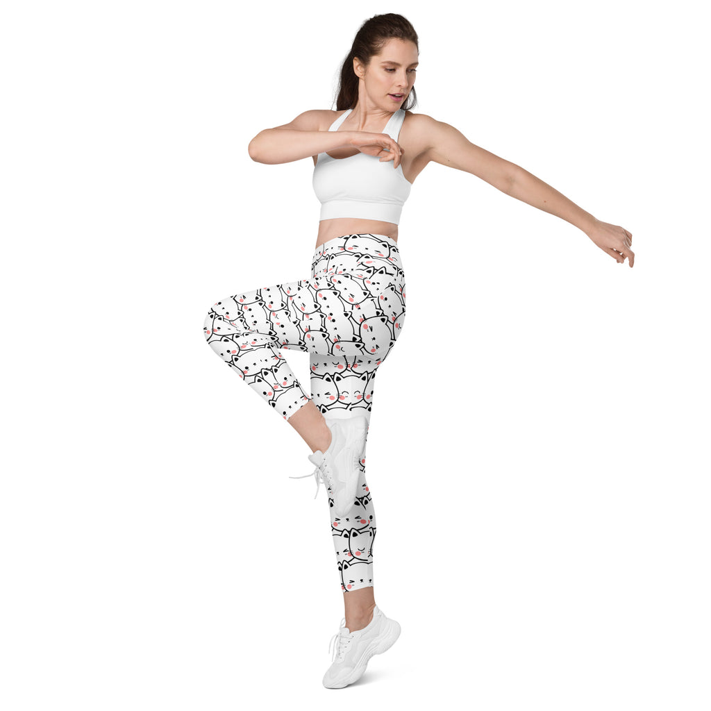 White high-waisted kawaii cat face yoga leggings with pockets featuring black and pink cartoon cat patterns