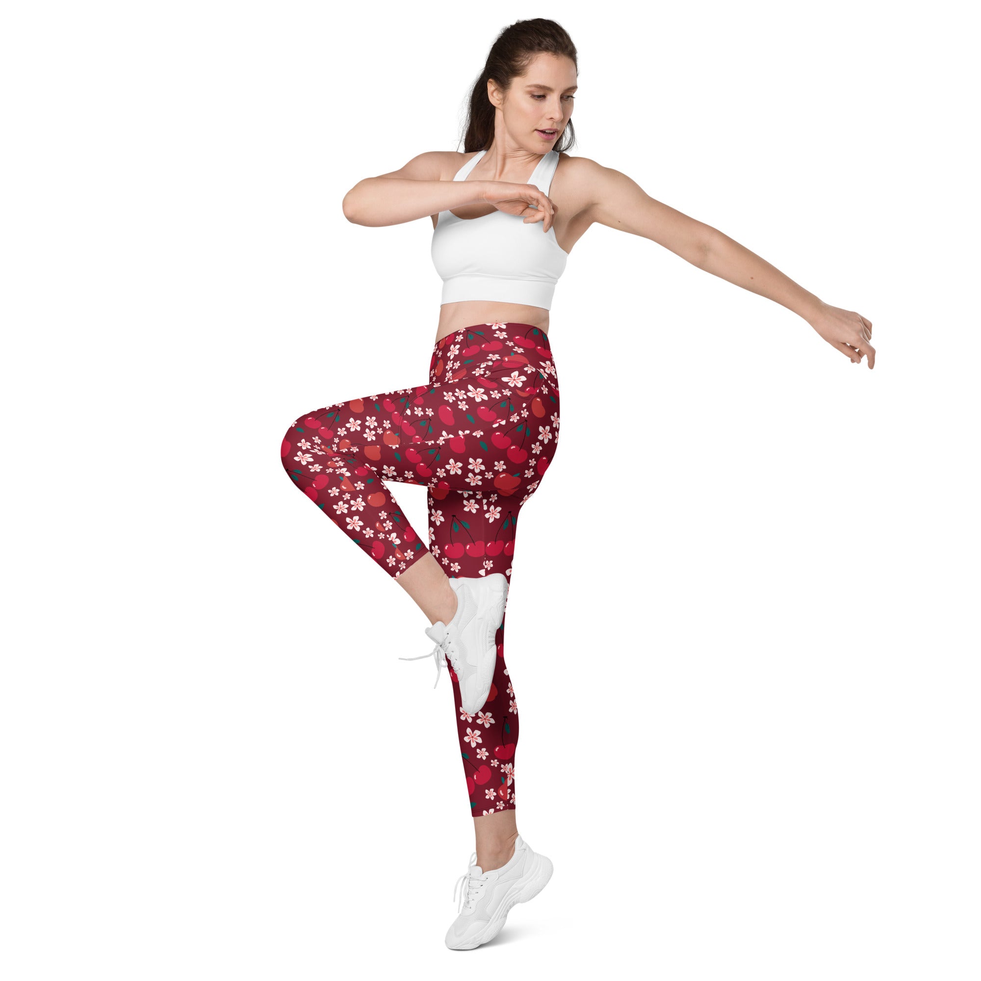 Women’s cherry blossom yoga leggings with pockets featuring red and white floral high-waisted soft compression fabric
