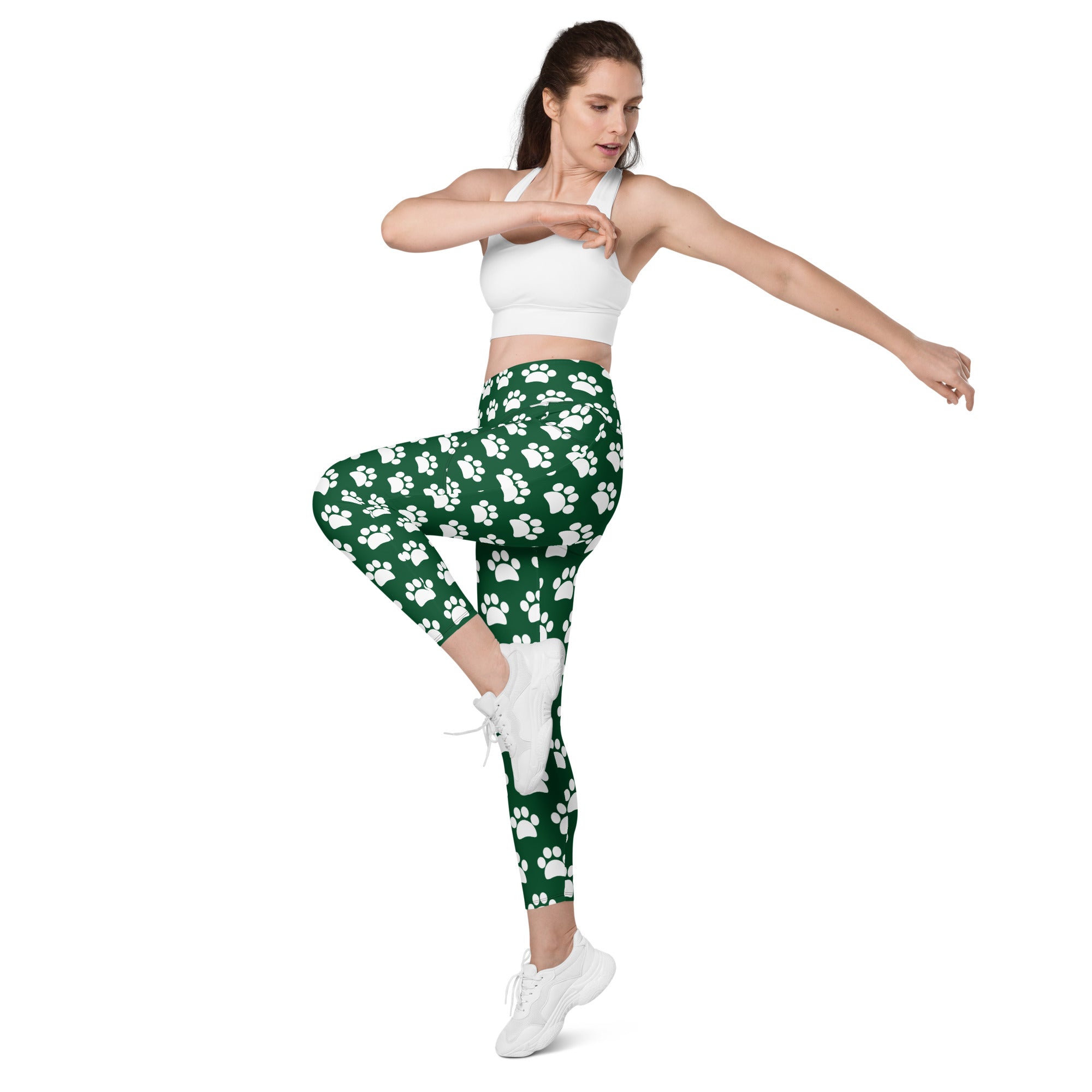 Women’s green high-waisted yoga leggings with white paw prints soft compression fabric and pockets