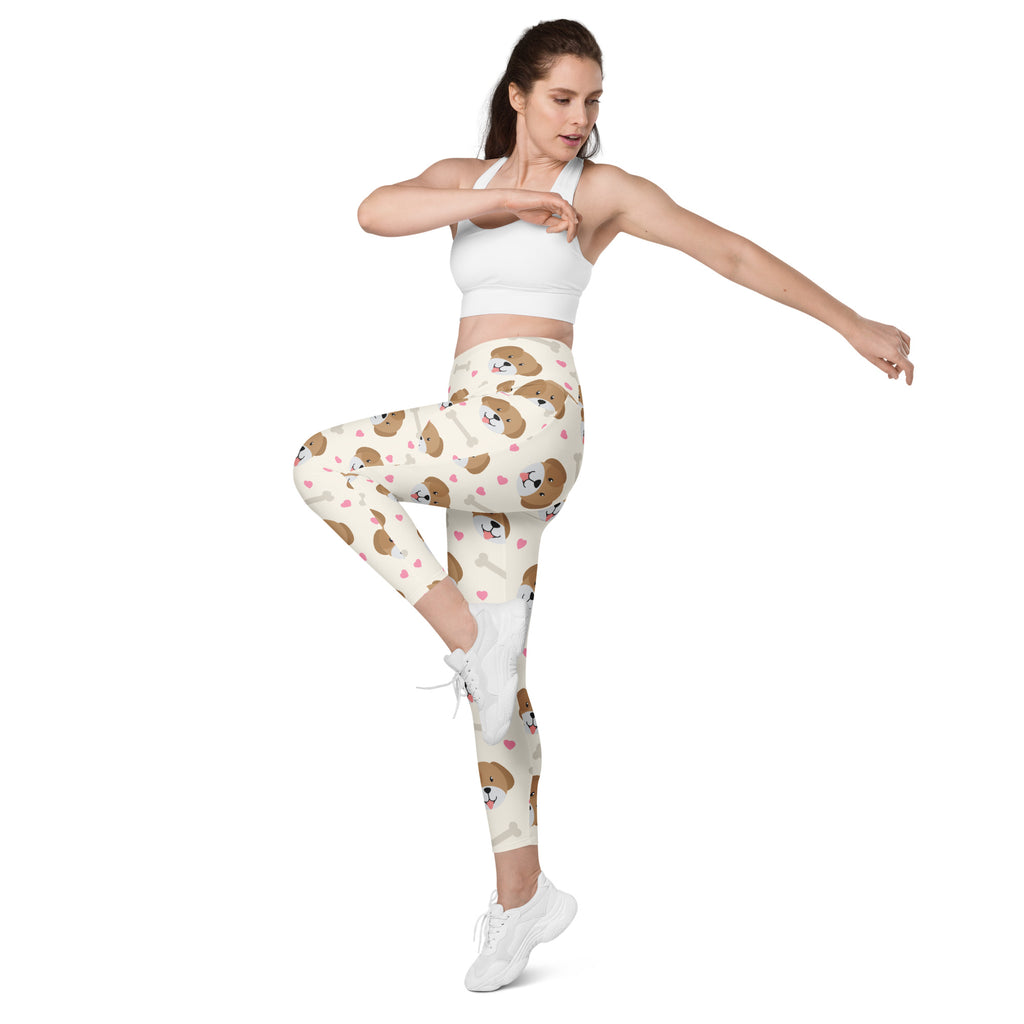 Women’s cream-colored cute dog yoga leggings with pockets featuring brown beagle faces and pink hearts pattern