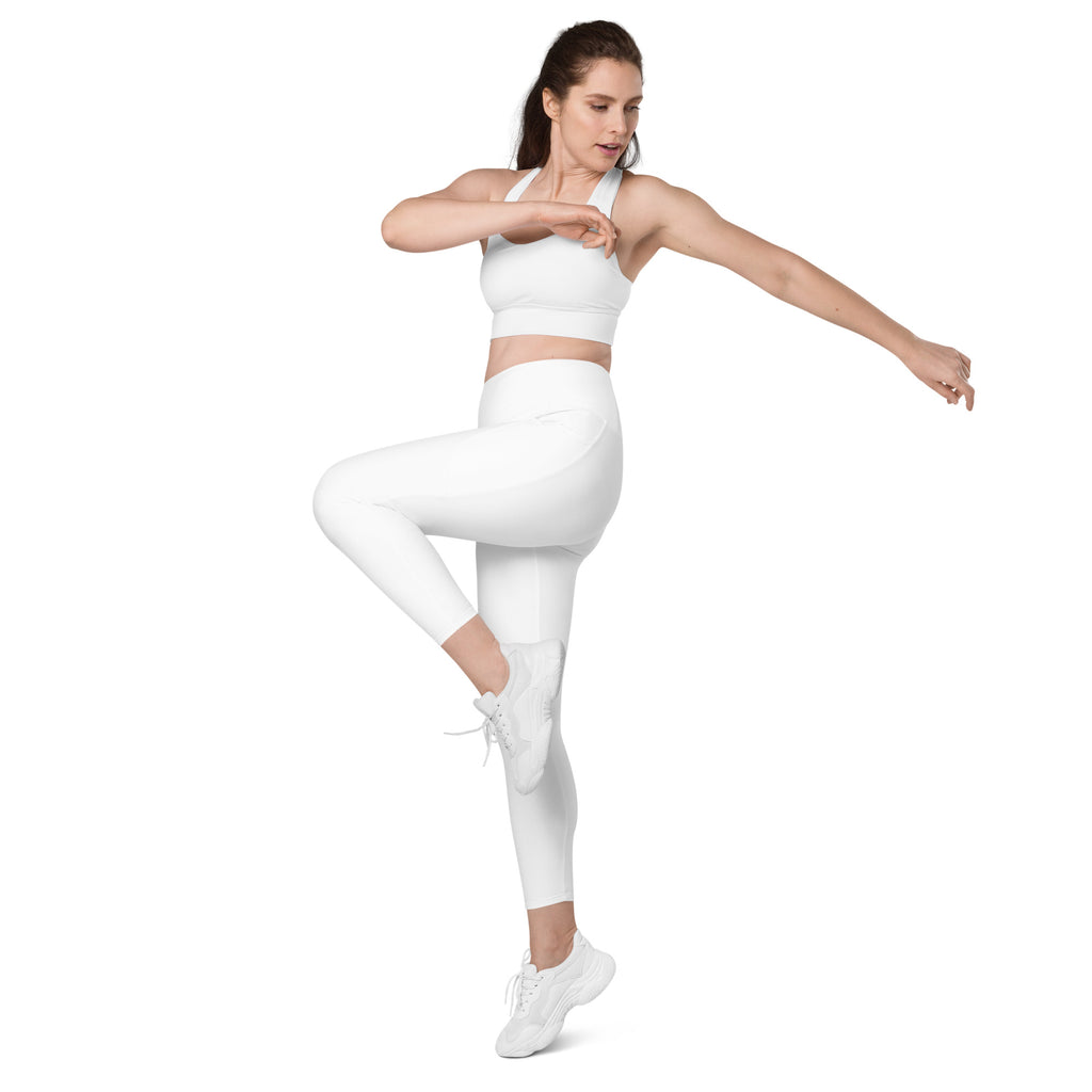 White seamless athletic two-piece set with crop top and high-waisted leggings featuring soft compression and pockets