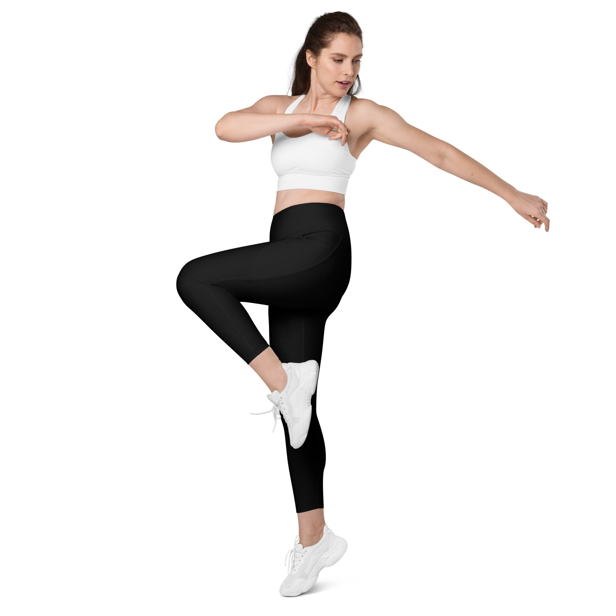 Women’s black high-waisted yoga leggings with pockets made of smooth stretchy fabric and seamless construction