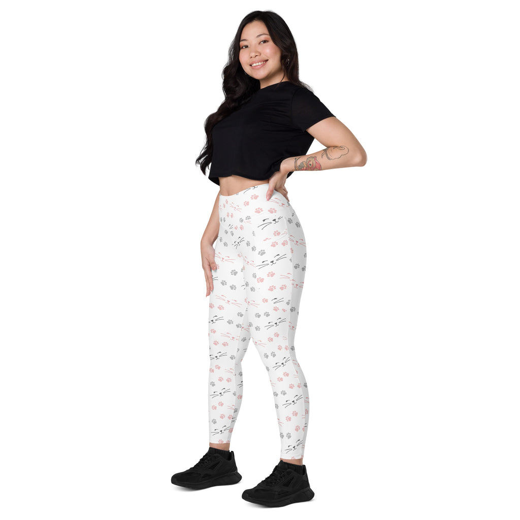 White high waisted yoga leggings with soft compression featuring pink and gray cat face pattern and pockets