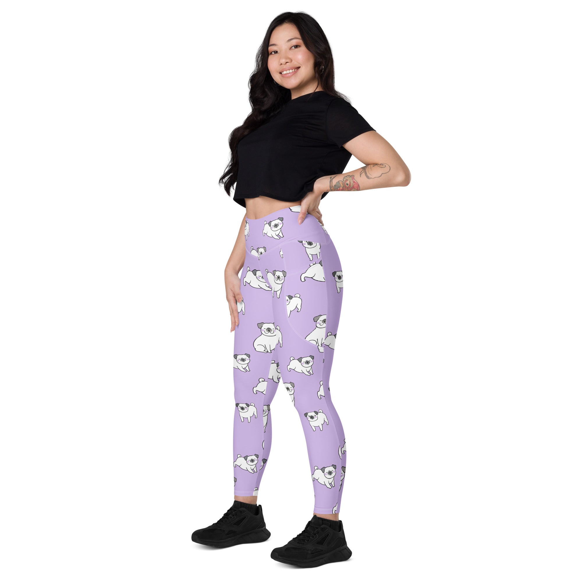 Women’s lilac high-waisted yoga leggings with pockets featuring soft compression and white pug patterns