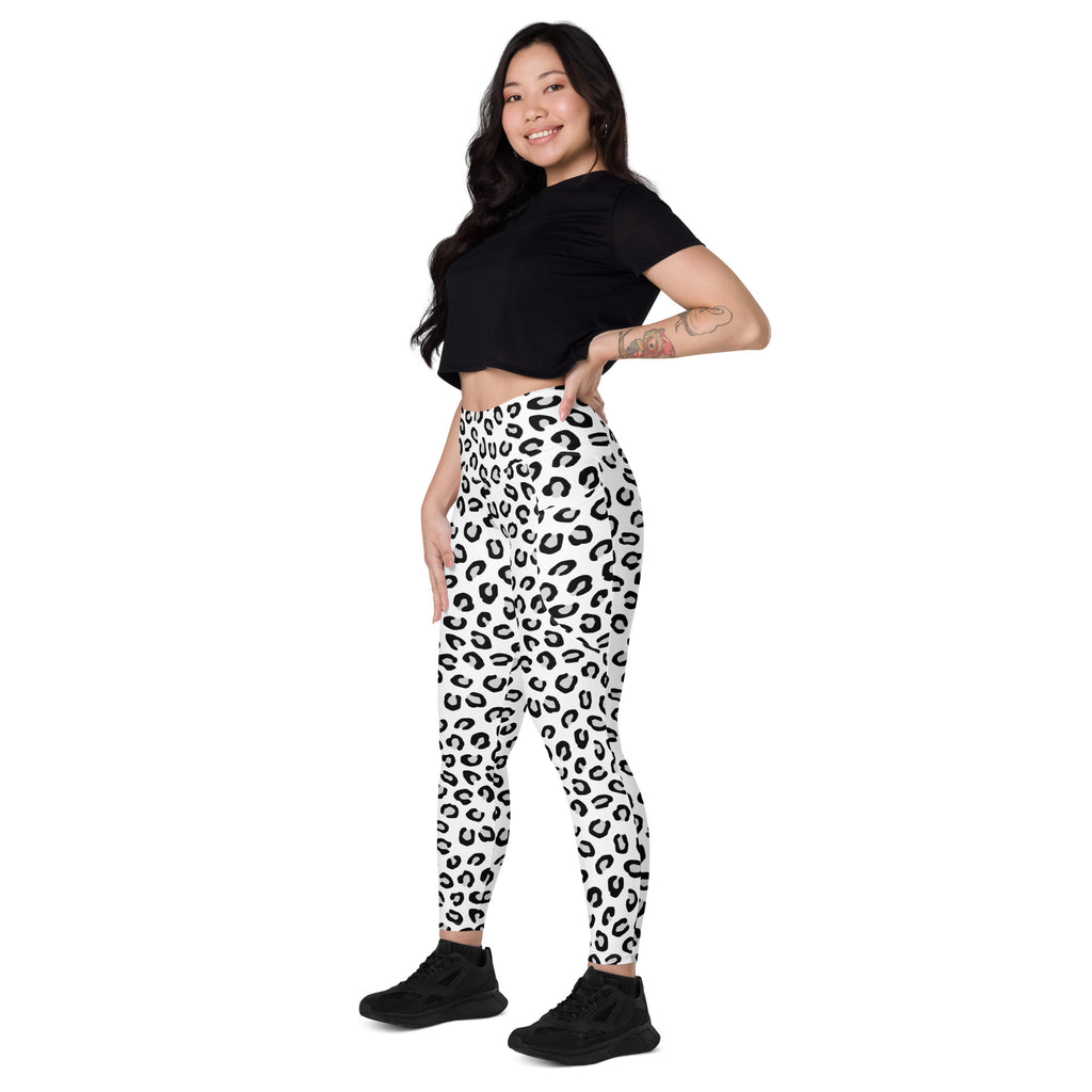 Women’s high-waisted black and white leopard yoga leggings with pockets made from soft compression fabric