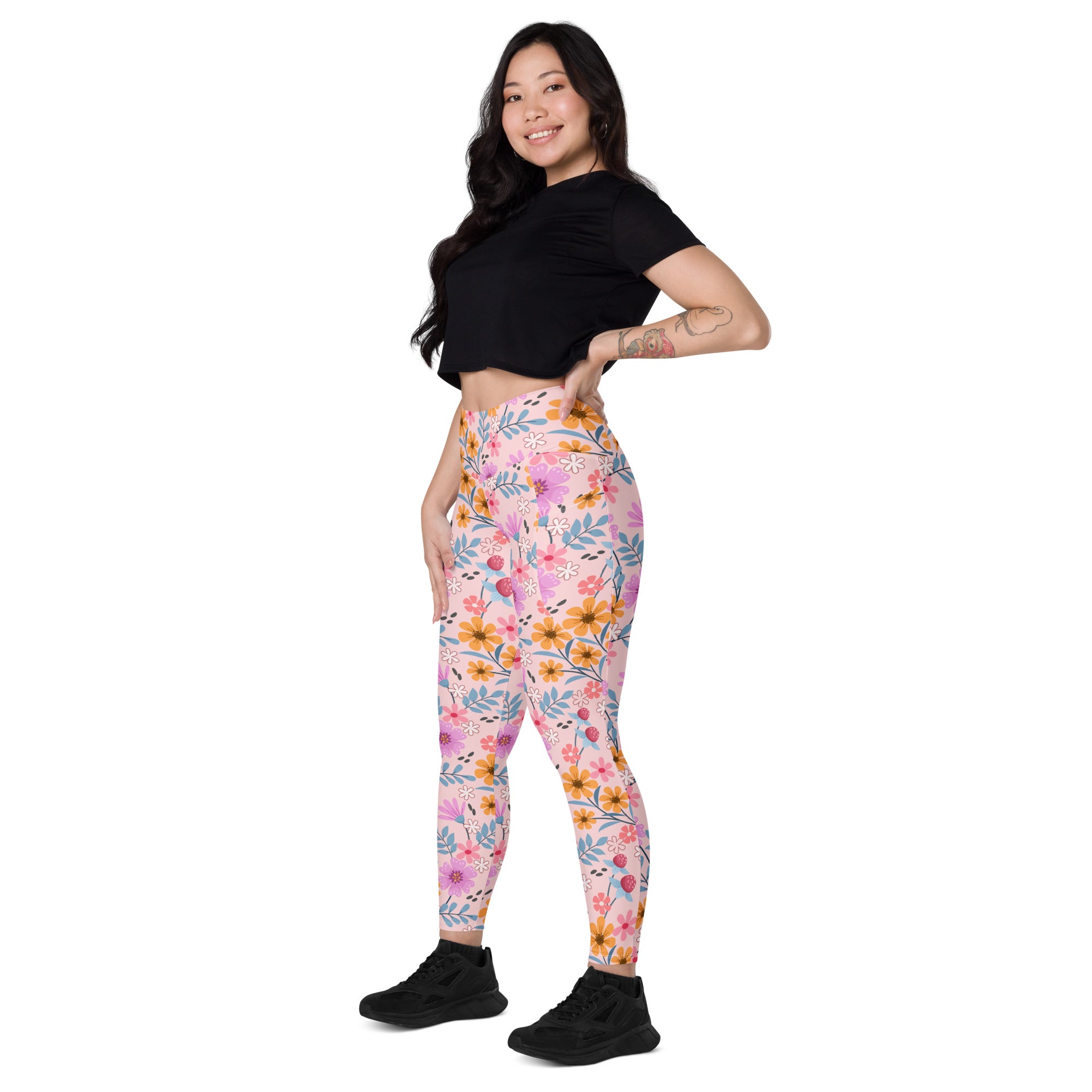 Women’s pink floral yoga leggings with pockets high waisted soft compression fabric and yellow orange blue flowers