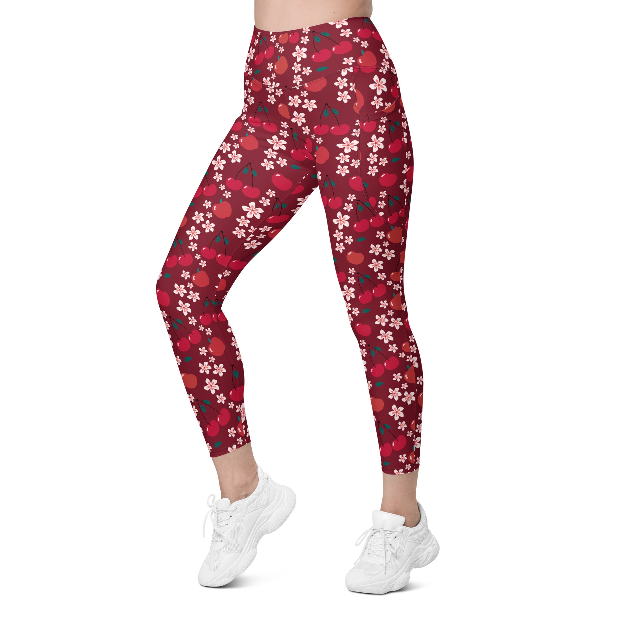 Women’s high-waisted cherry blossom yoga leggings with pockets featuring red cherry and white flower pattern and soft compression