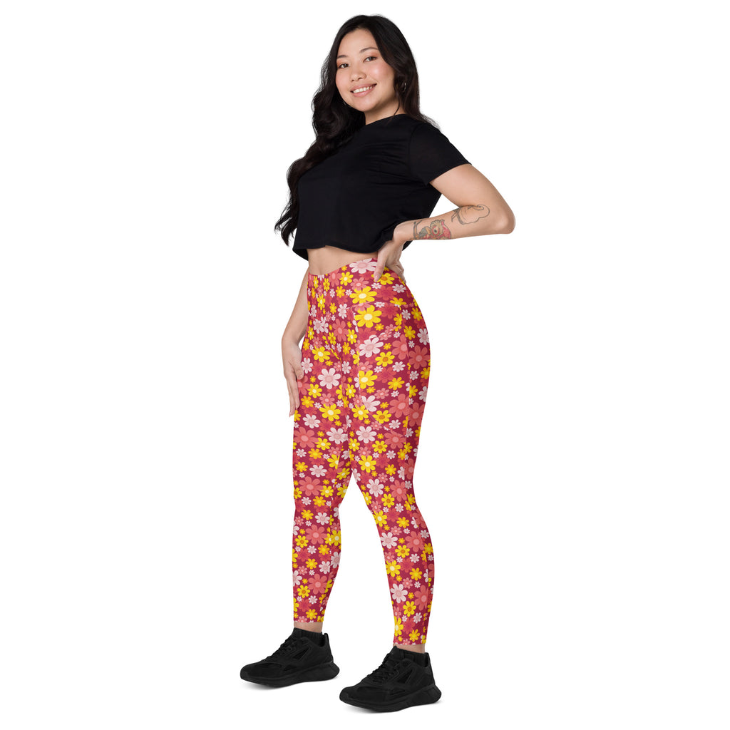 Women’s high-waisted soft compression yoga leggings with vibrant pink and yellow floral pattern and pockets