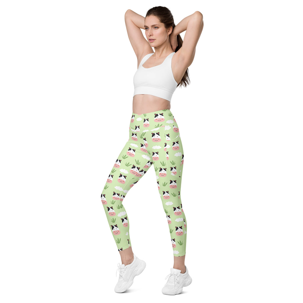 Women’s light green cute cow yoga leggings with pockets high-waisted soft compression fabric featuring cartoon cow faces and grass