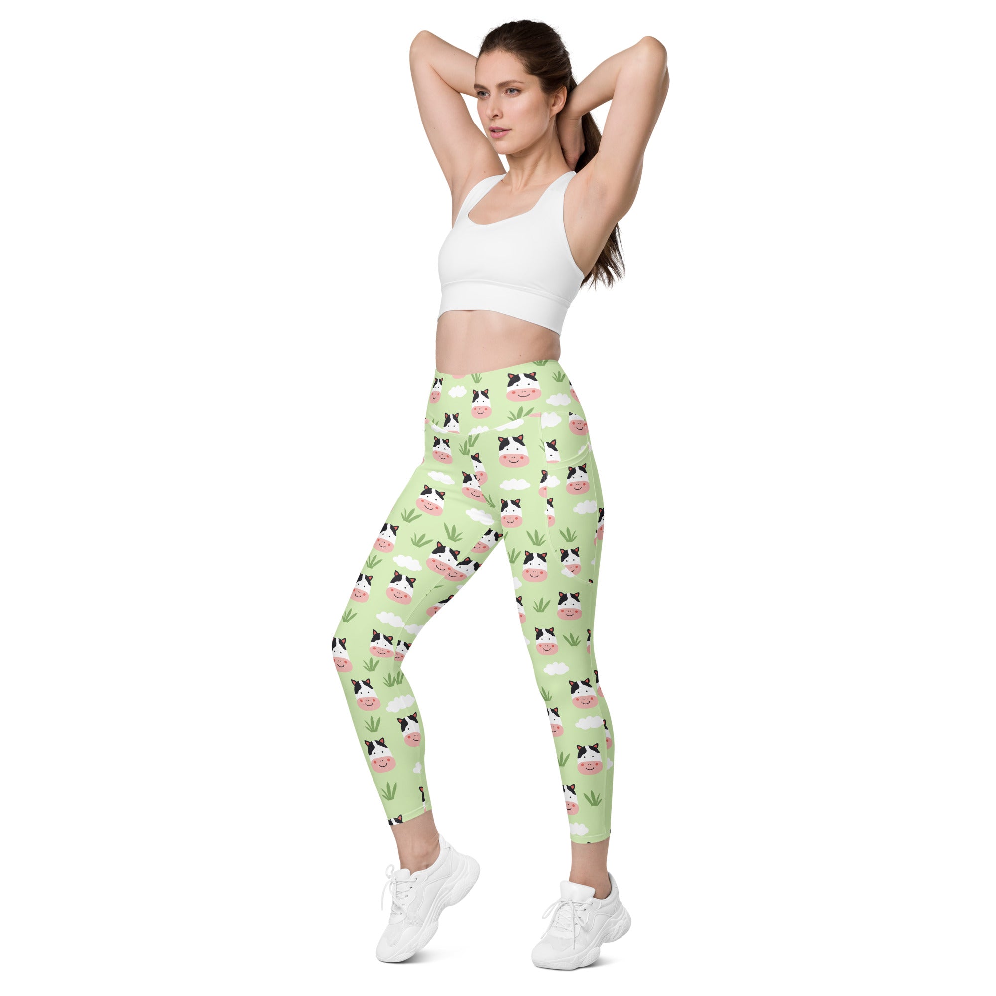 Women’s light green cute cow yoga leggings with pockets high-waisted soft compression fabric featuring cartoon cow faces and grass