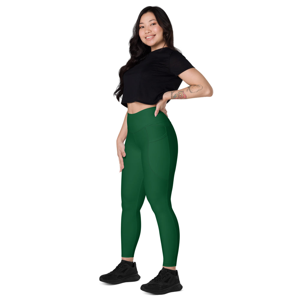 Women’s dark green high-waisted yoga leggings with pockets made of soft compression fabric for active wear