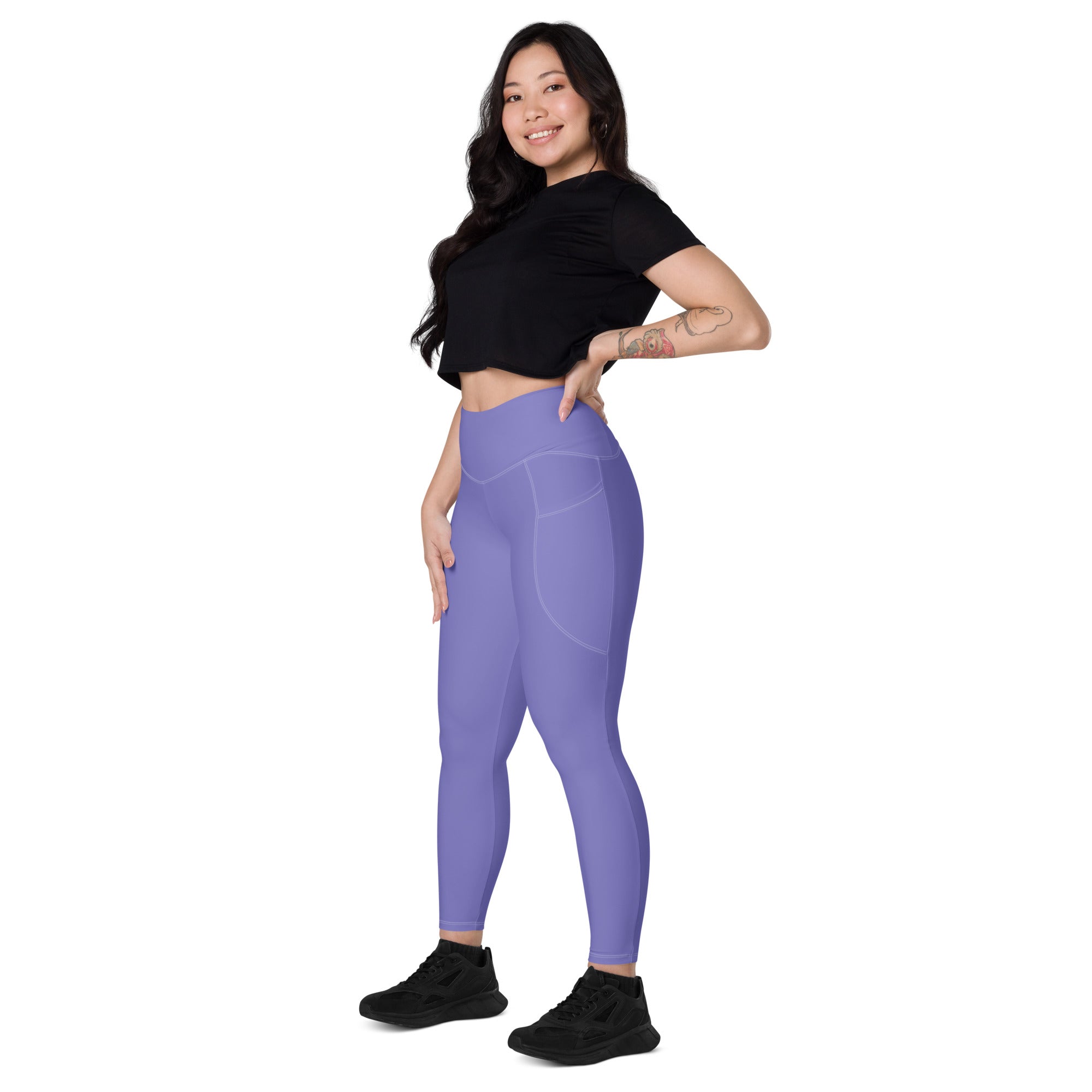 Women’s lavender high-waisted yoga leggings with smooth form-fitting material and subtle side pockets
