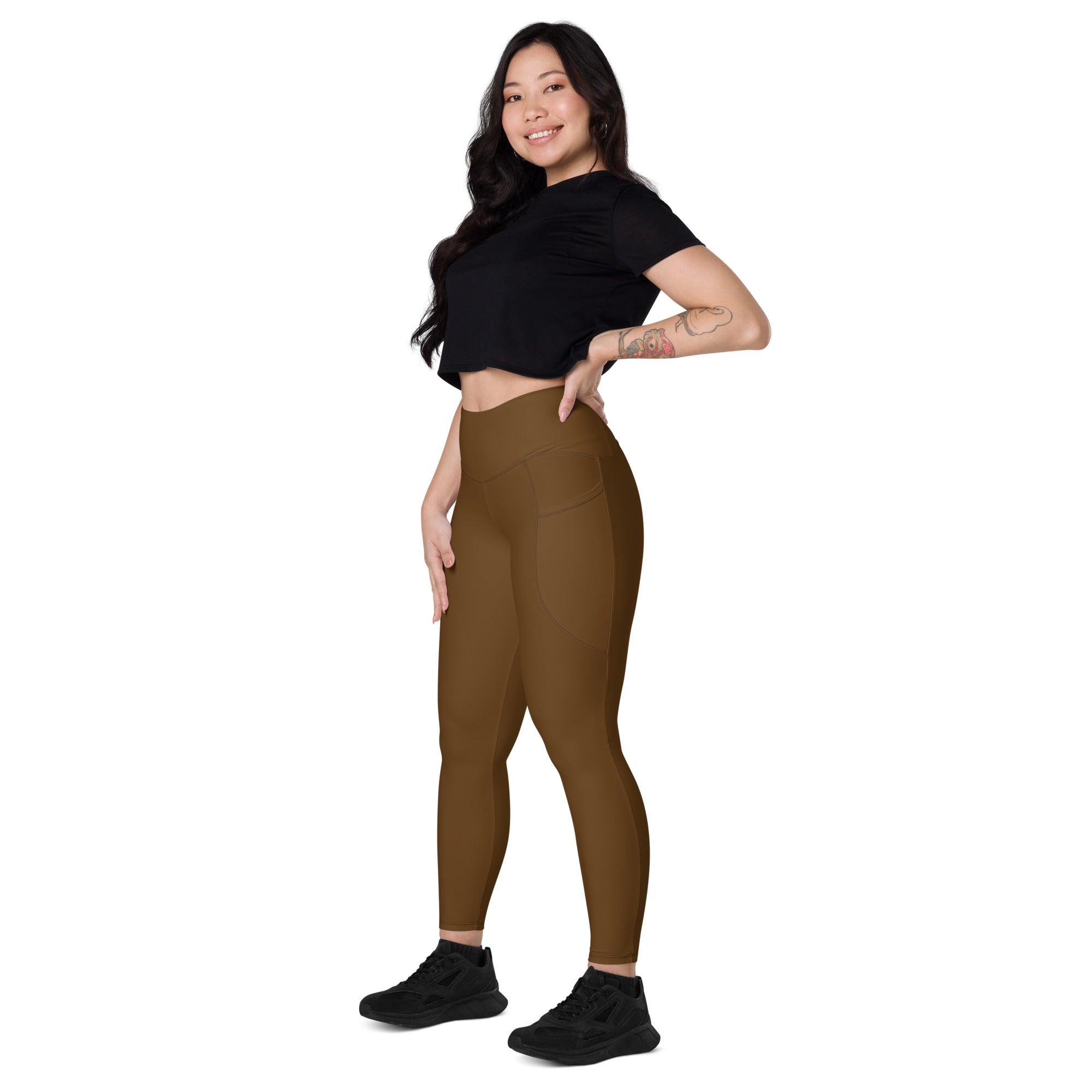 Women’s brown high-waisted yoga leggings with pockets and smooth form-fitting soft compression fabric