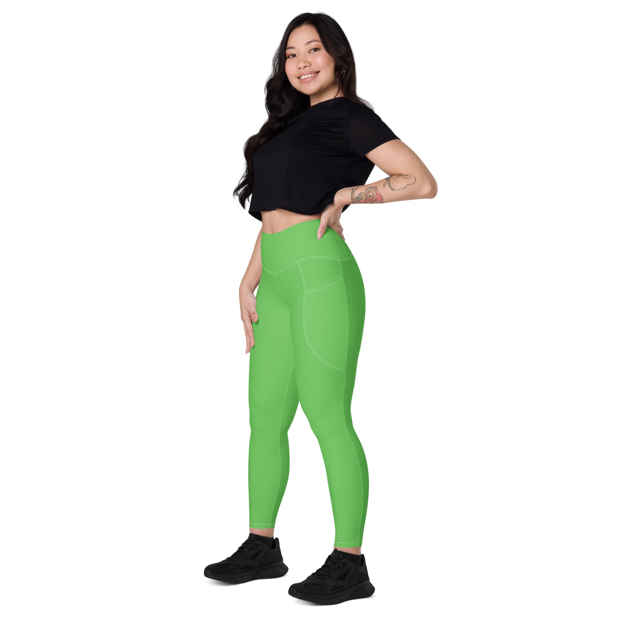 Bright green high-waisted women’s yoga leggings with pockets soft compression and a sleek form-fitting design