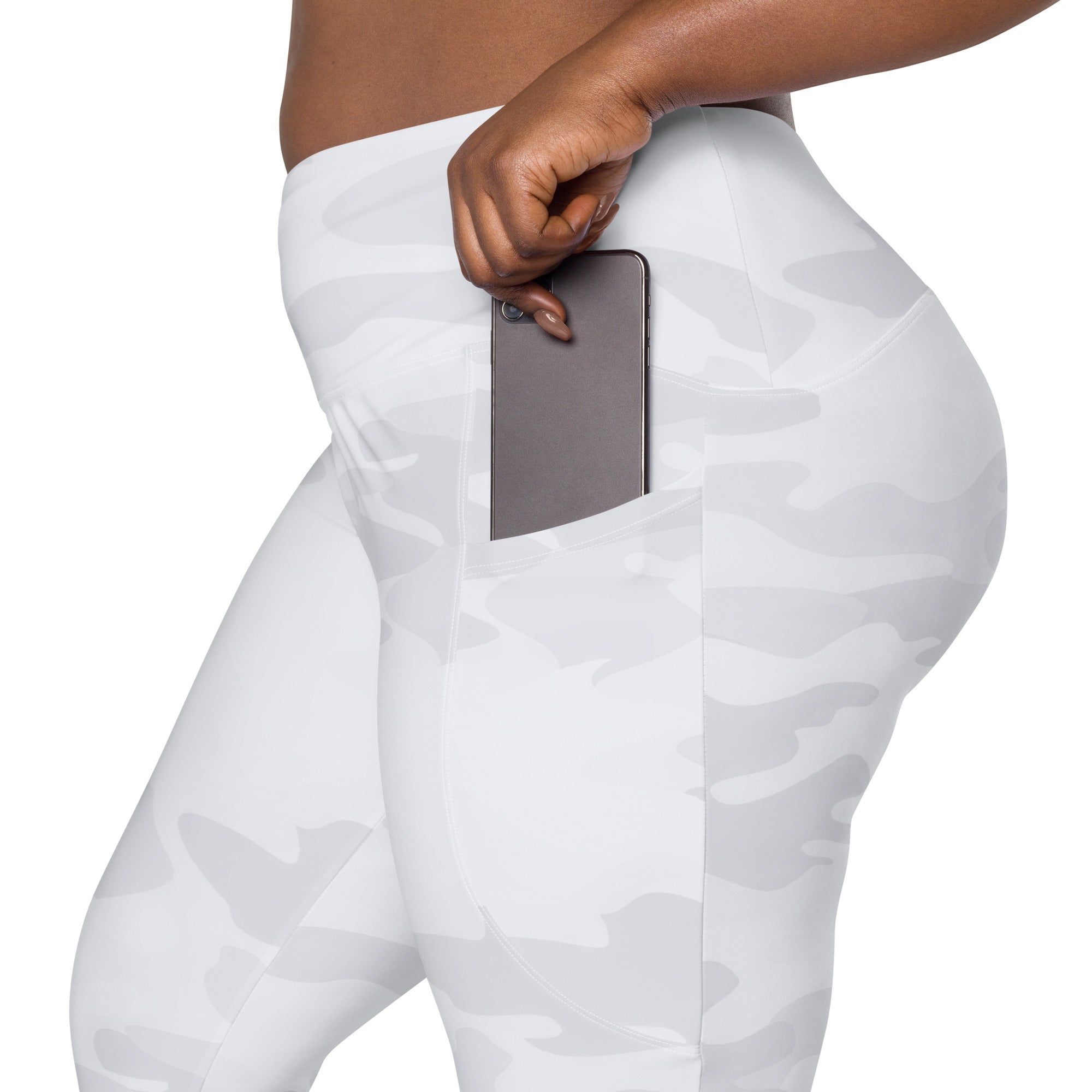 Women’s gray camouflage high waisted soft compression yoga leggings with side pocket holding a smartphone