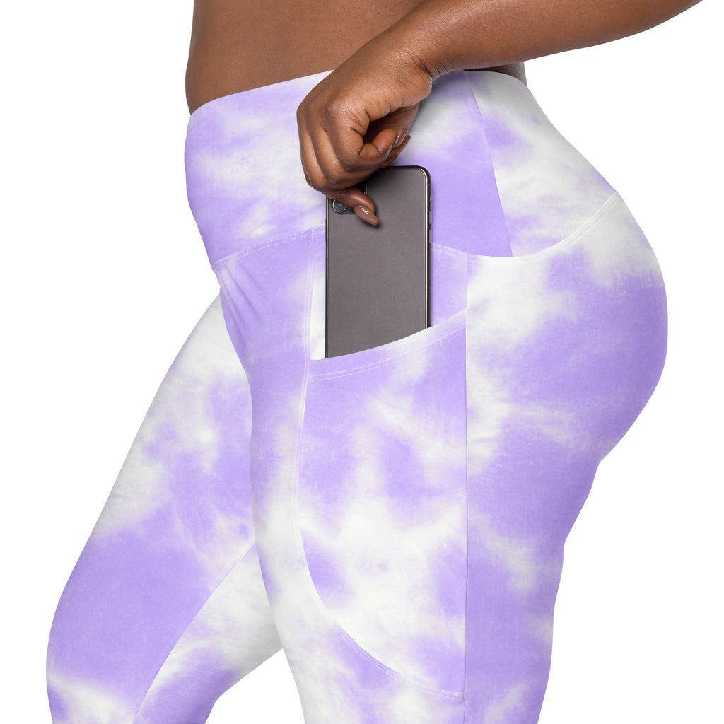 Women’s purple and white tie dye high waisted yoga leggings with soft compression and side pocket holding smartphone